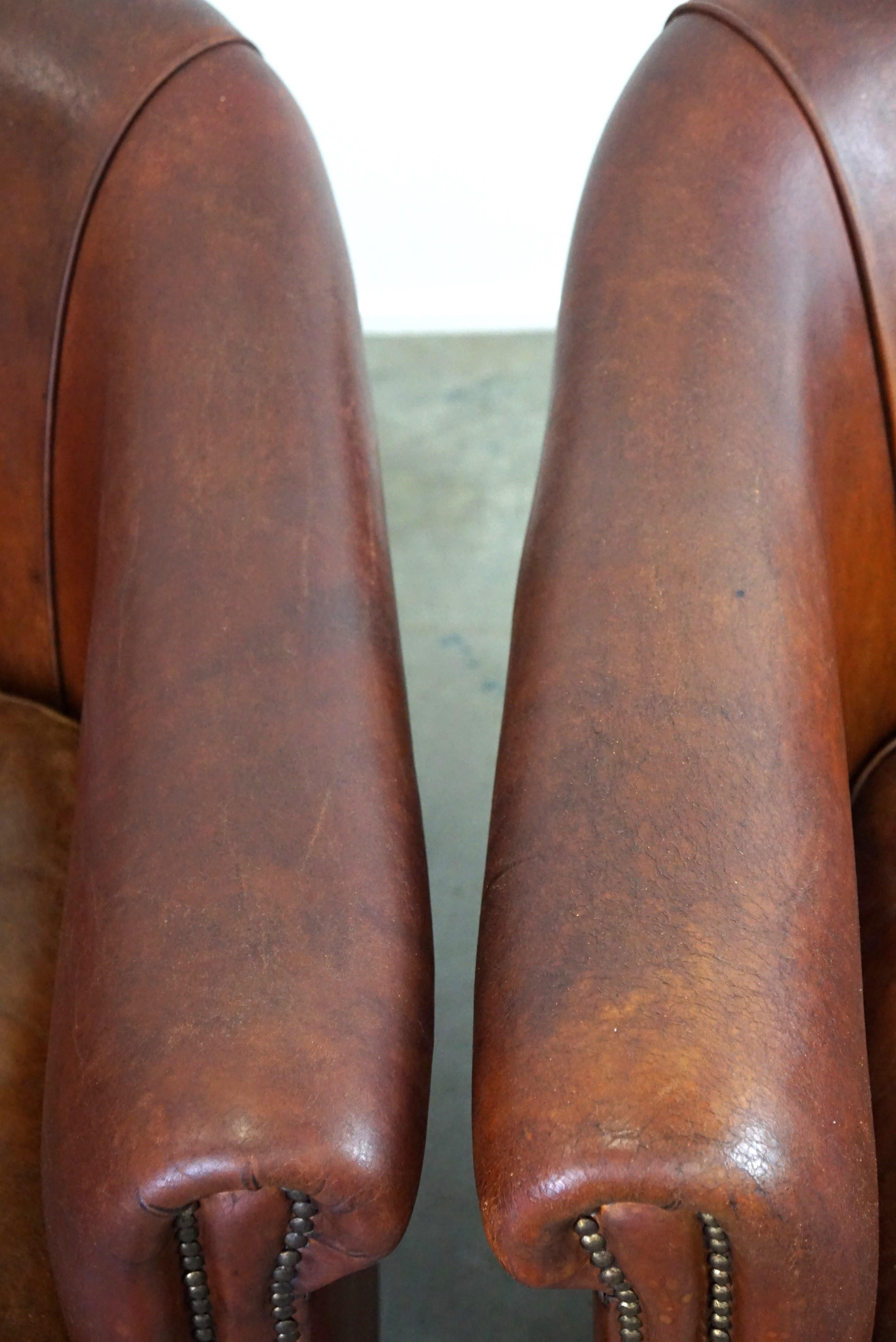 Cuir Ensemble de deux fauteuils club vintage en cuir de mouton au caractère robuste