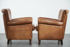 Set of two vintage sheepskin armchairs with beautiful and warm colours