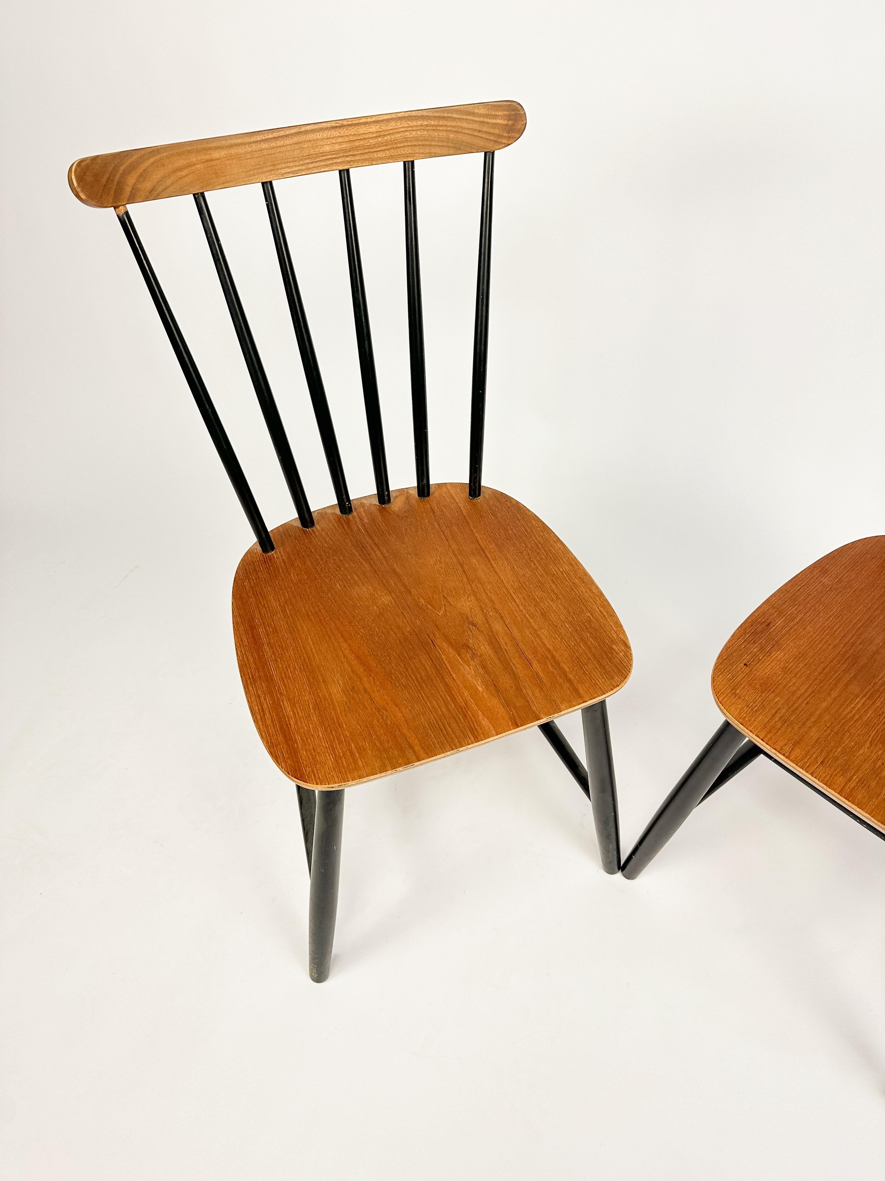 Set of Two Vintage Spindle Back Chairs in the style of Ilmari Tapiovaara.