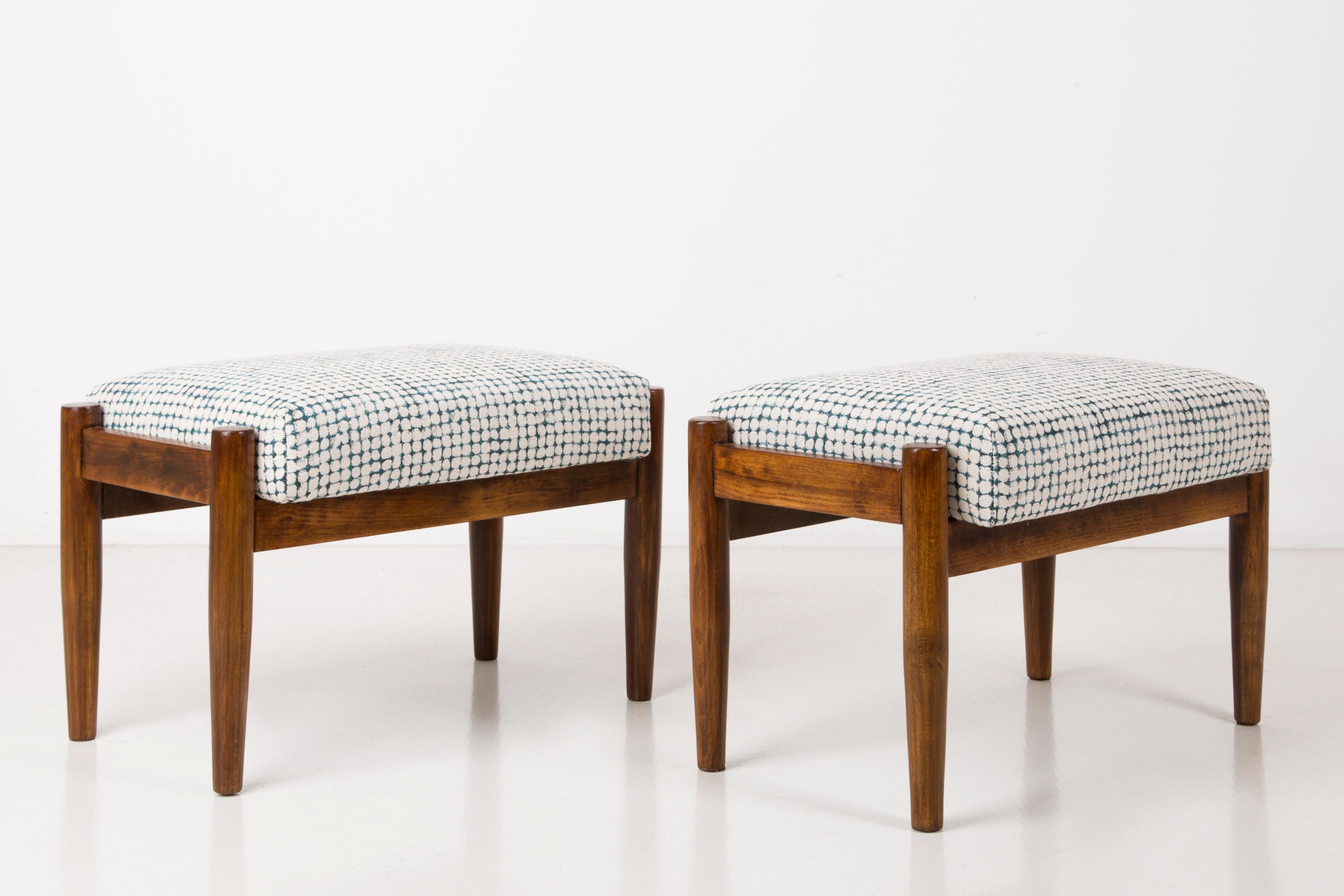 Stools from the turn of the 1960s. Beautiful white and aqua high quality upholstery. The stools consists of an upholstered part, a seat and wooden legs narrowing downwards, characteristic of the 1960s style. We can prepare this stools also in