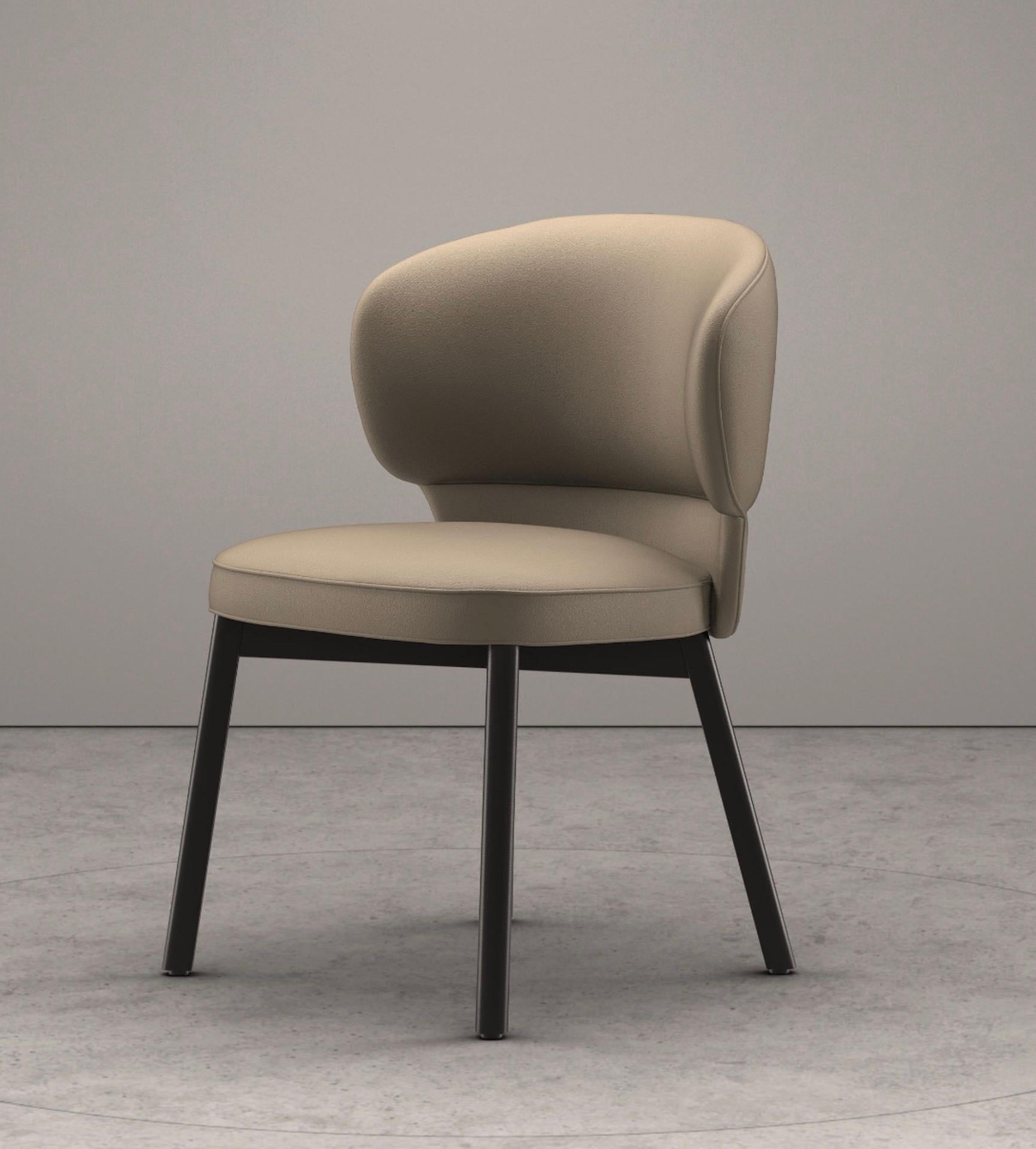 dimensions: W 57cm, seat width 48cm, H 82cm, seat height 49cm, D 62cm, seat depth 50cm
legs: ash black lacquered
Upholstered: Nappa stone 
MORTON is a statement – a deft blend of elegant upholstered chair and armchair that holds its own both at a