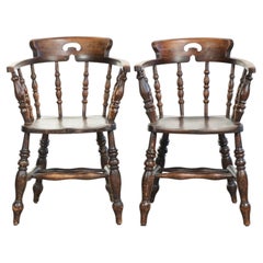 Set of two wooden English antique captain chairs from the late 19th century