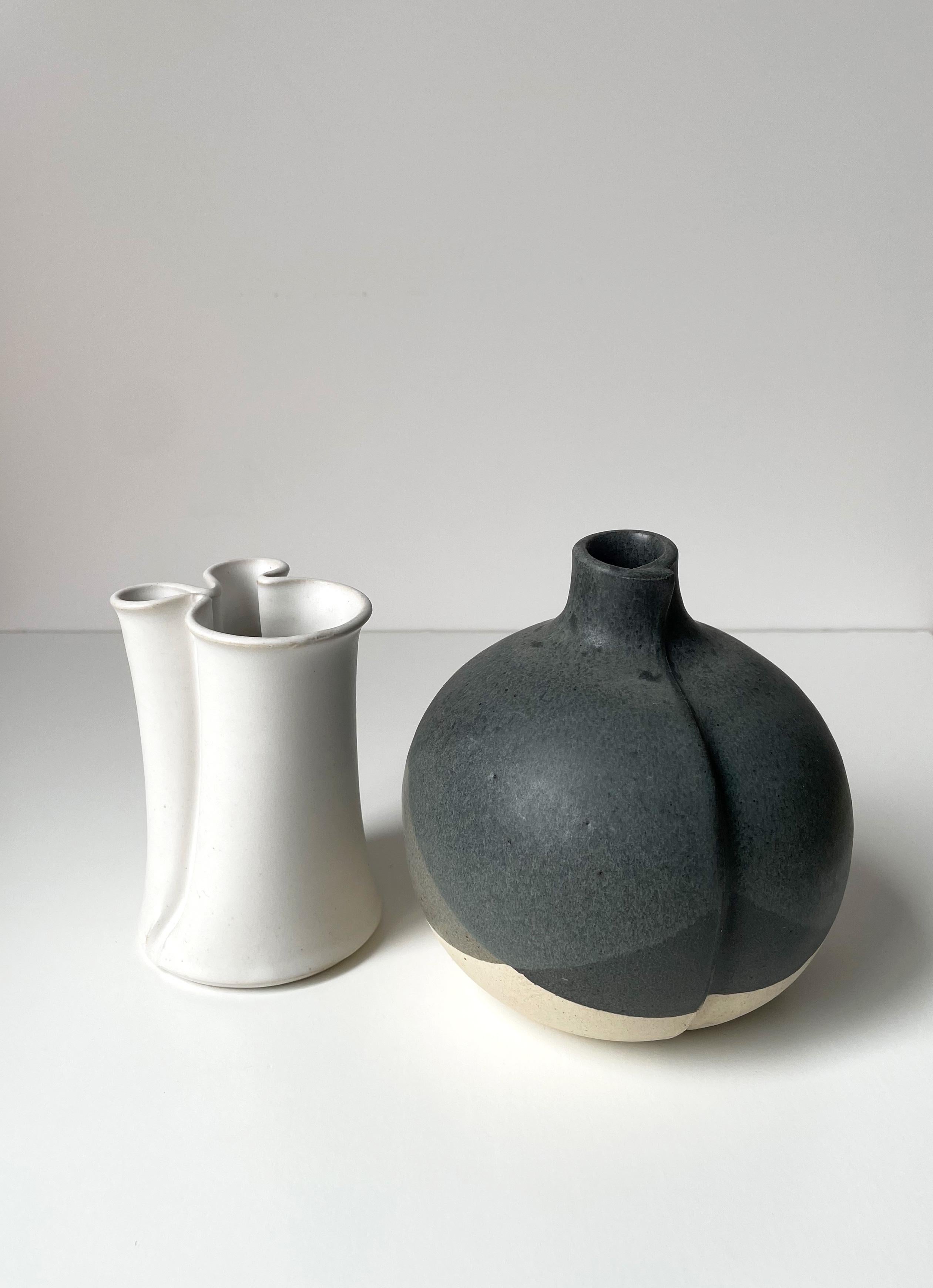 Set of two Danish modernist vases with soft, organic shapes and muted colors designed by acclaimed ceramic artist Aage Würtz in the 1980s. The father-son duo KH Würtz is one of Denmark's most recognized ceramic companies making handmade tableware
