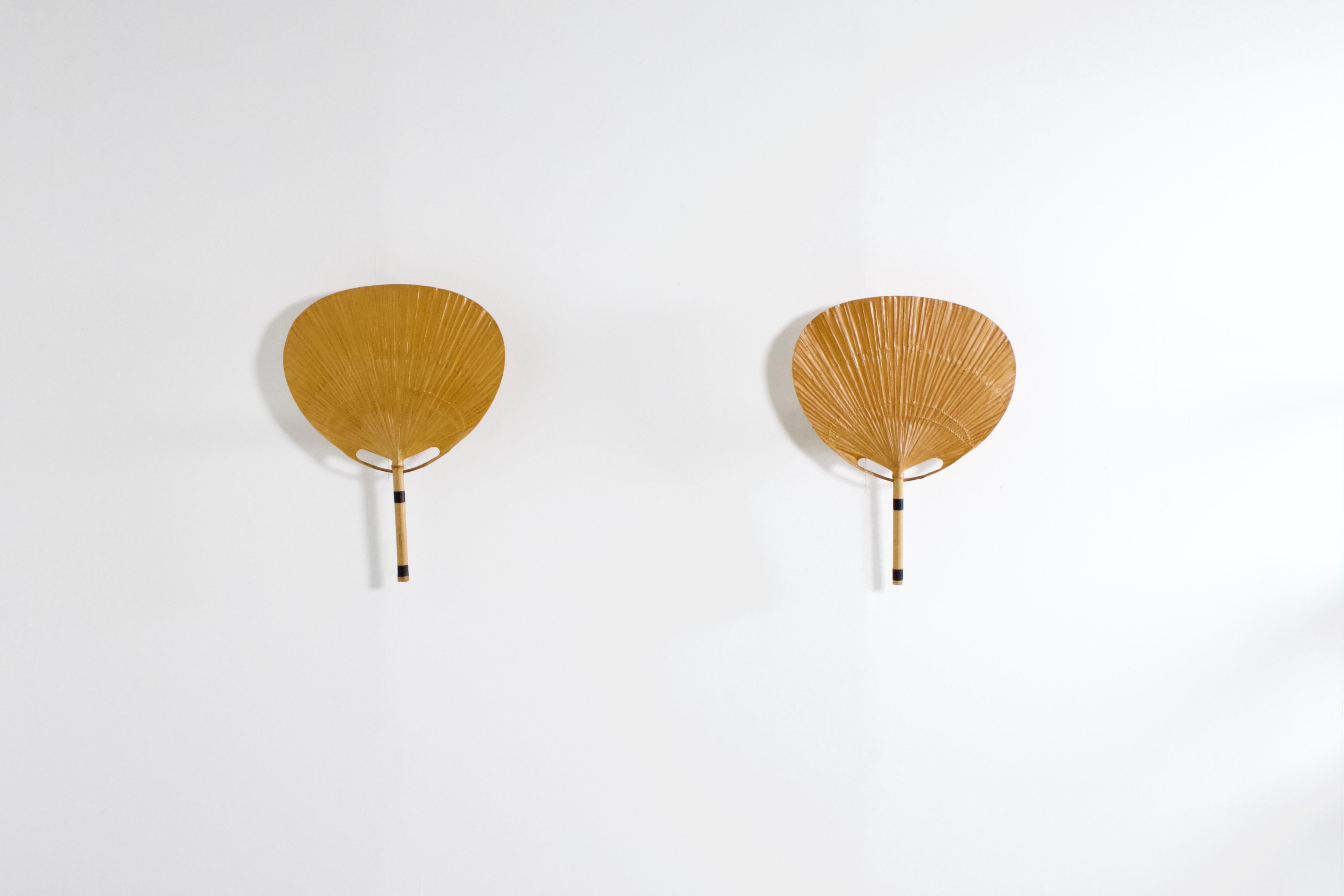 Set of ‘Uchiwa’ fan wall lamps by Ingo Maurer in very good condition. 

Designed by Ingo Maurer for M design, Germany. 

These lamps were handmade in 1977 from bamboo, wicker and Japanese rice paper. 

They are very fragile and therefor very
