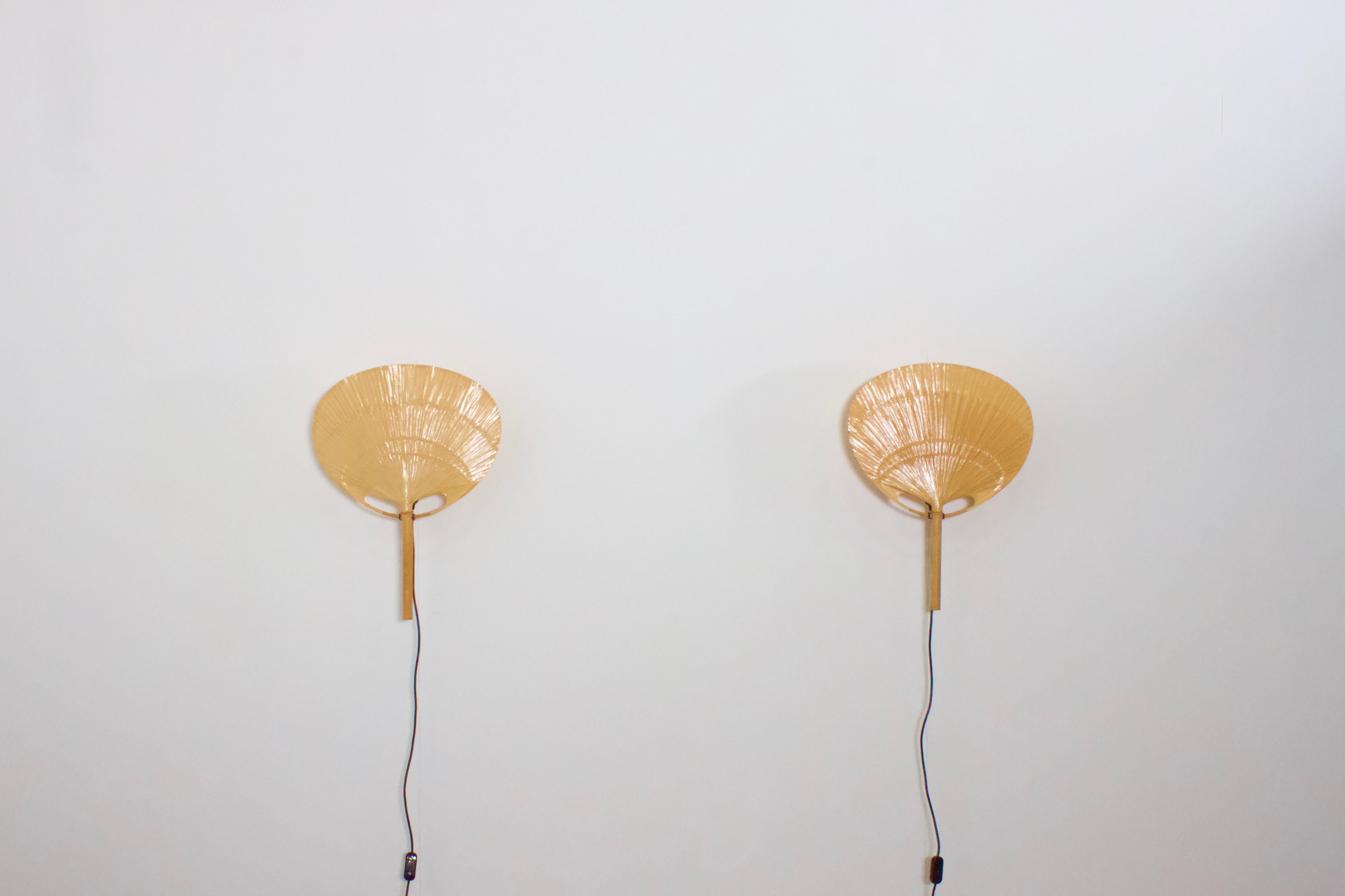 Set of ‘Uchiwa II’ fan wall lamps by Ingo Maurer in very good condition. 

Designed by Ingo Maurer for M design, Germany. 

These lamps were handmade in 1977 from bamboo, wicker and Japanese rice paper. 

They are very fragile and therefor