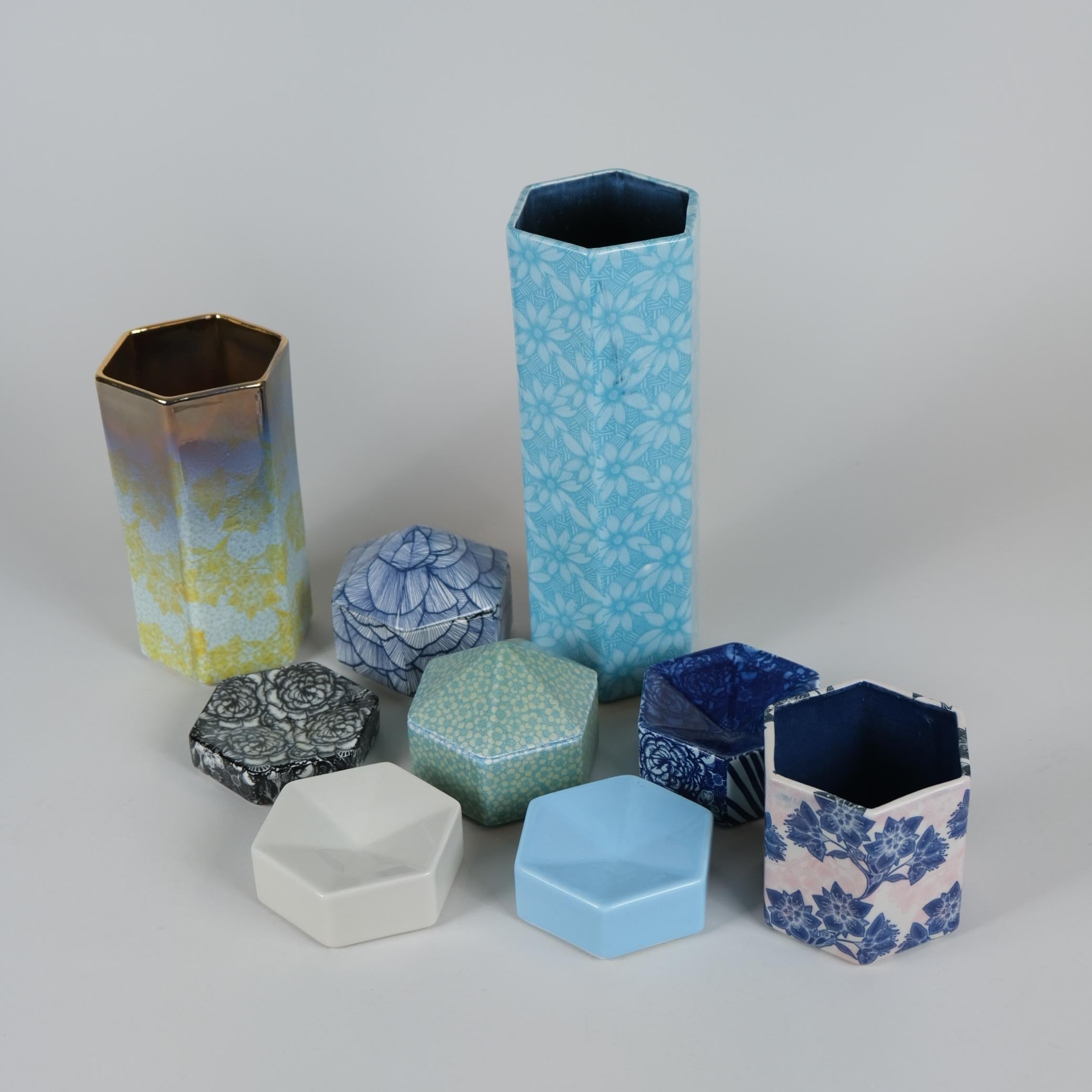A beautiful set of unique hexagon pieces by one of the most talented contemporary ceramic artists in Finland, Heini Riitahuhta, known for her distinctive style and vibrant floral patterns adorning Arabia Finland products for over 2 decades. Heini's