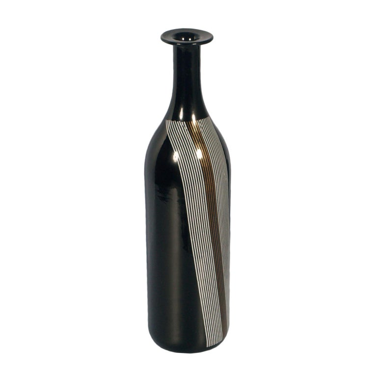 They can be sold separately
Mid-Century Modern set vases Tapio Wirkkala for Venini attributable in blown black Murano glass.

About:
Designed in 1968 by Tapio Wirkkala, these bottles are from the similar forms gently curved glass (black Murano