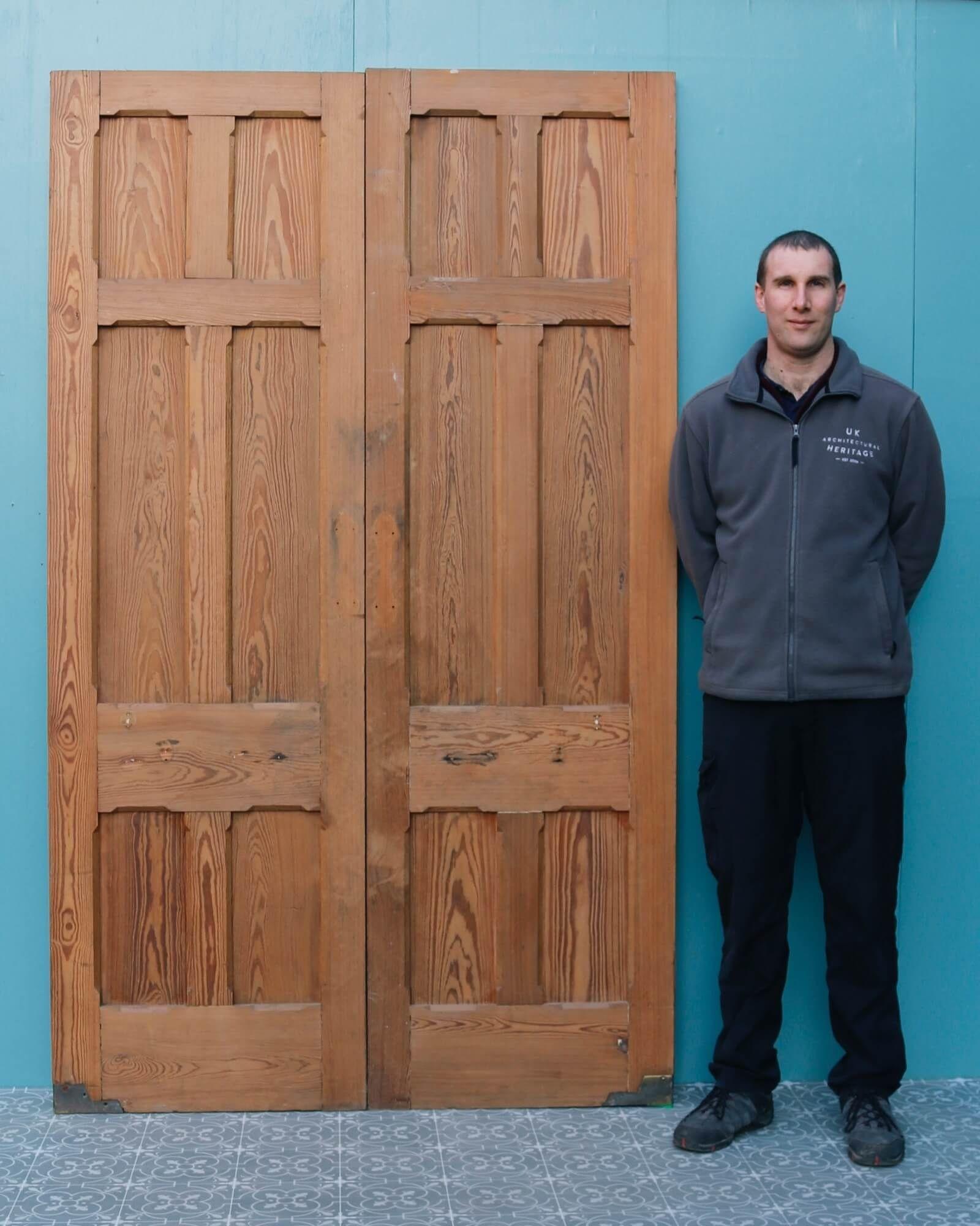 An elegant set of reclaimed internal double doors sourced from an English chapel, circa 1890. These antique doors are made from sturdy pitch pine and have a characteristic warm wood colour and grain that make for a beautiful pair of dividing doors