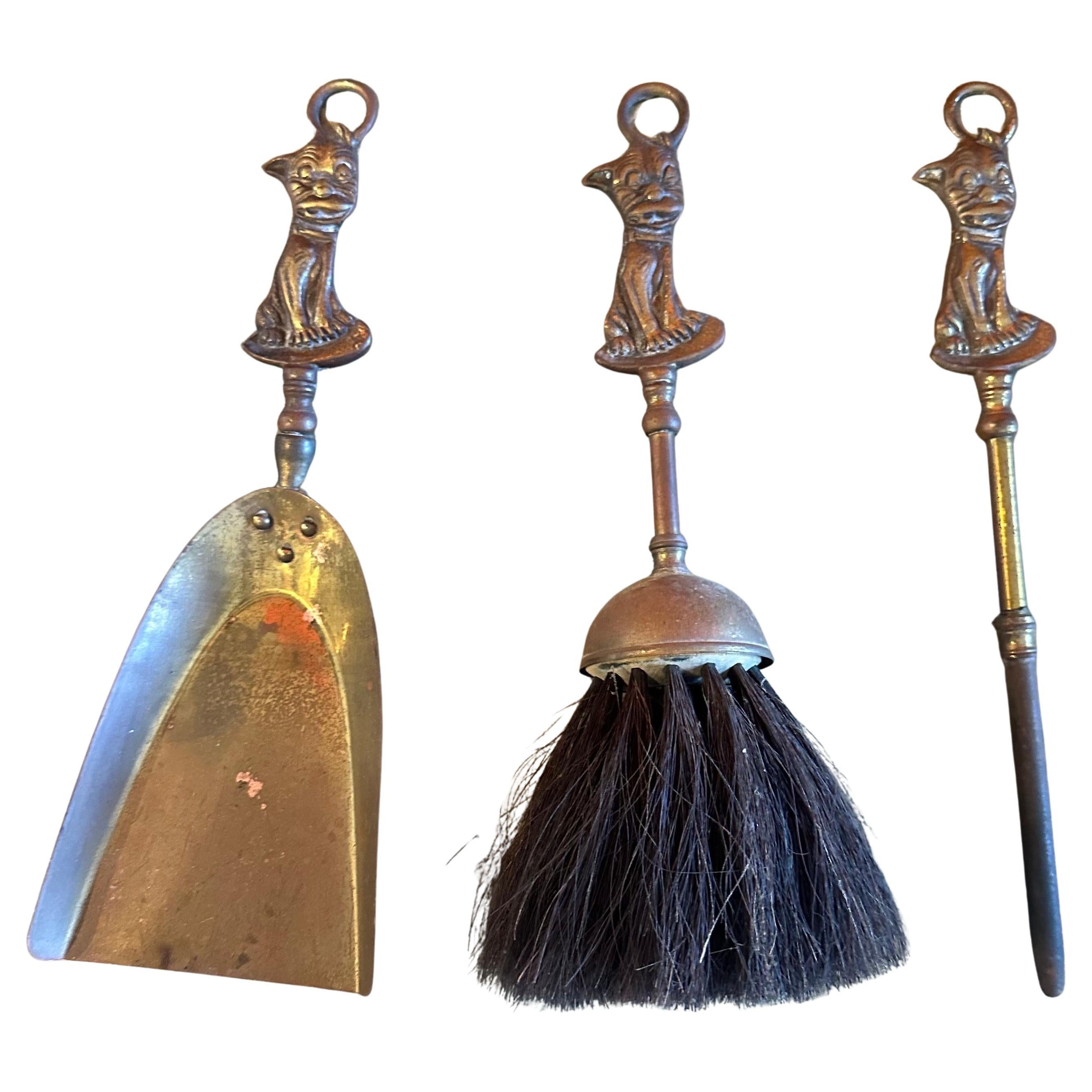 Set of vintage brass fireplace tools with 