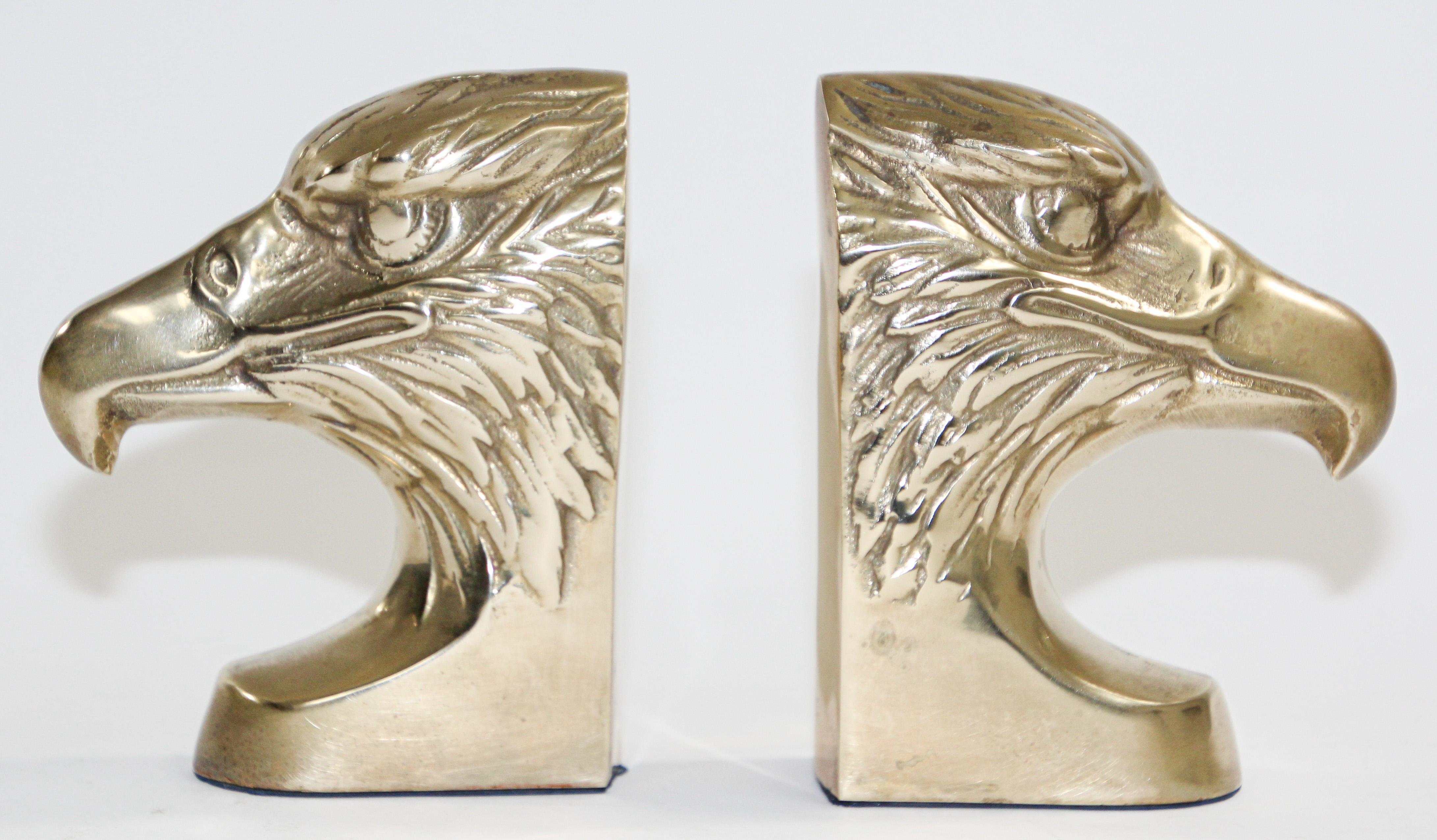 Set of vintage Mid-Century Modern cast metal brass patriotic bald eagle head sculpture bookends.
Pair of solid polished brass eagle heads that have a wonderful Early American class - Federal 