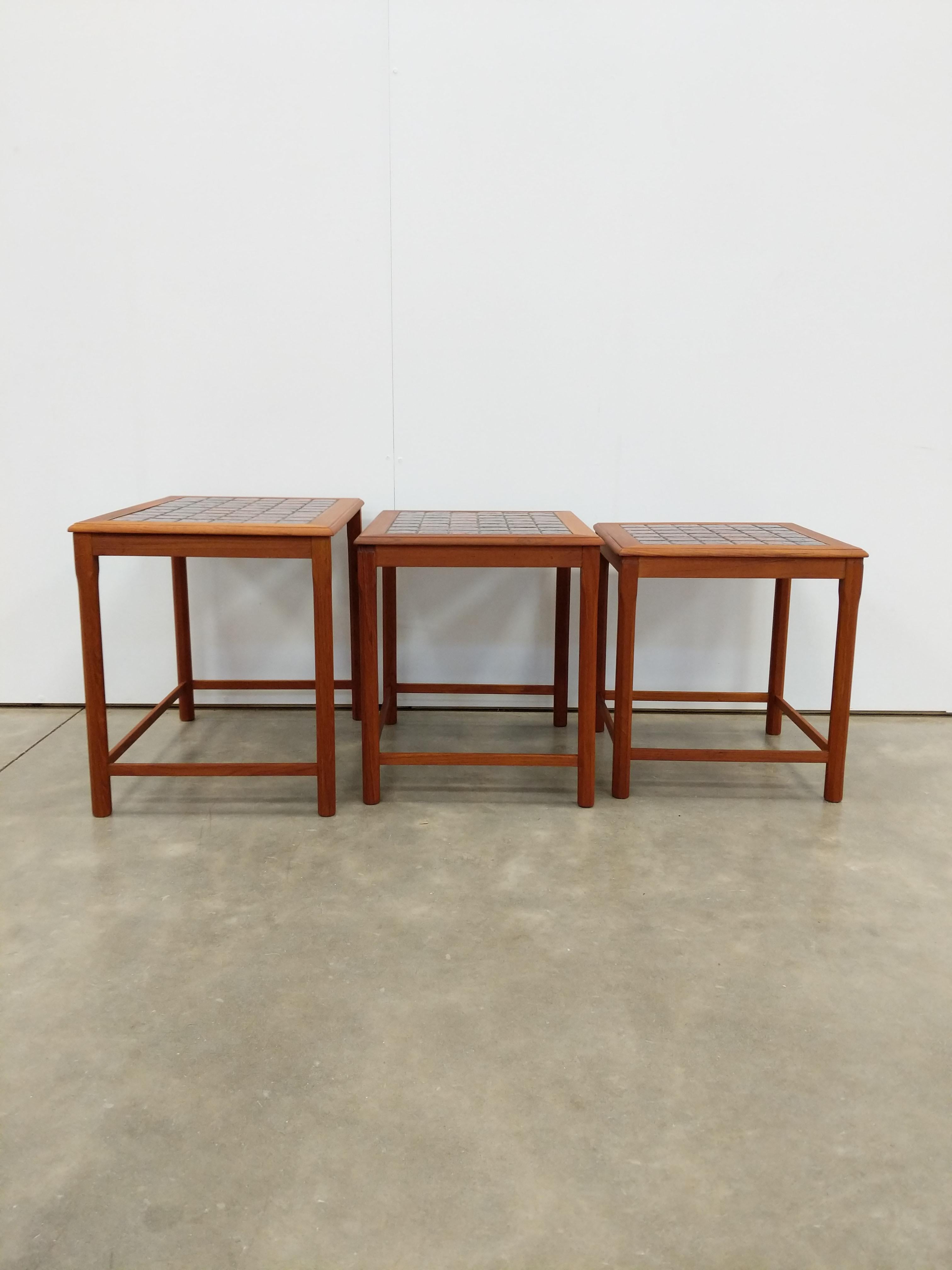 Set of 3 authentic vintage mid century Danish / Scandinavian Modern teak nesting tables.

This set is in excellent condition with few signs of age-appropriate wear (see photos).

If you would like any additional details, please contact