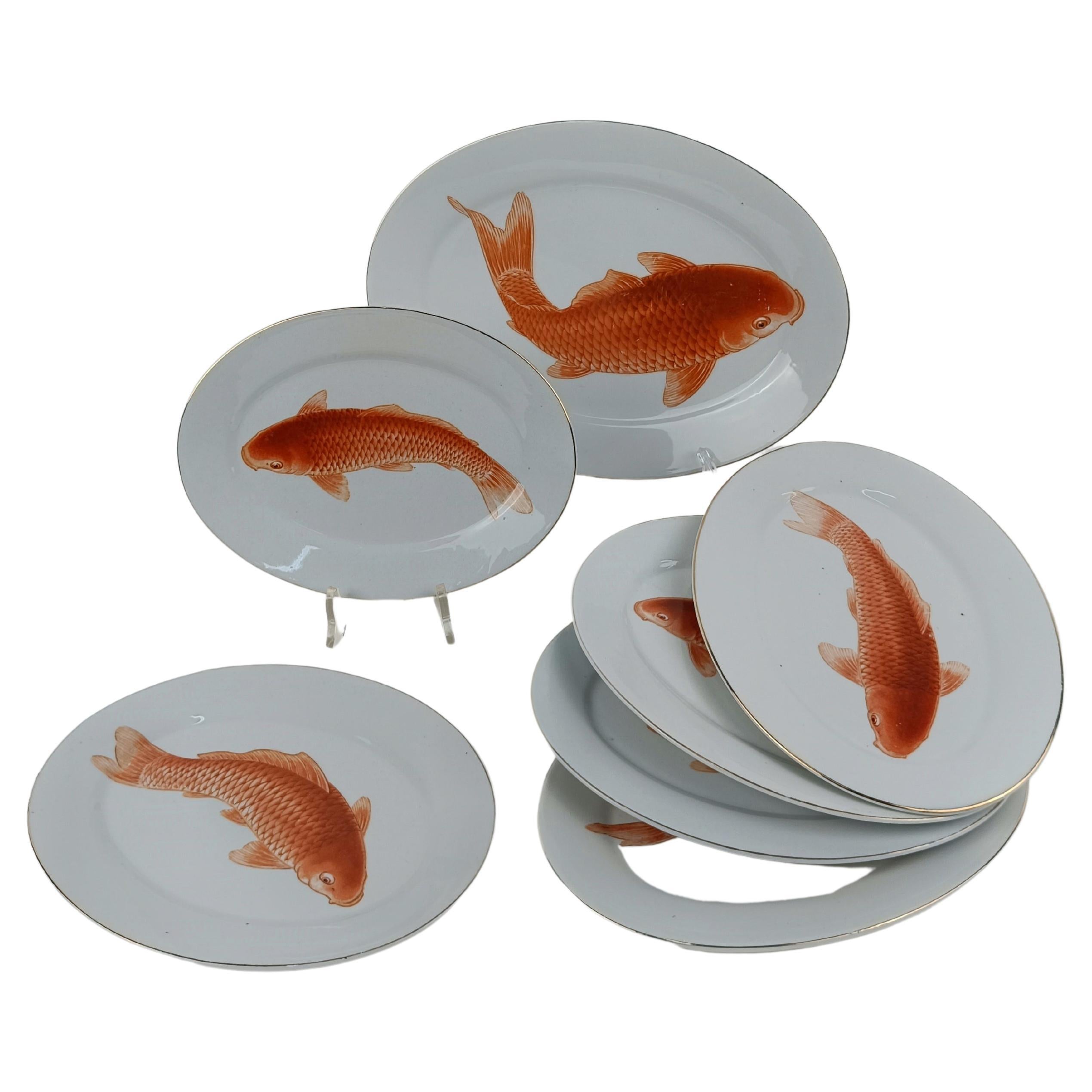Fine Porcelain and Koi Carp dart in every direction on six different plates, not counting the serving plate.

Don't be fooled by the Japanese decoration of these vintage plates because their origins are not oriental but European, precisely from the