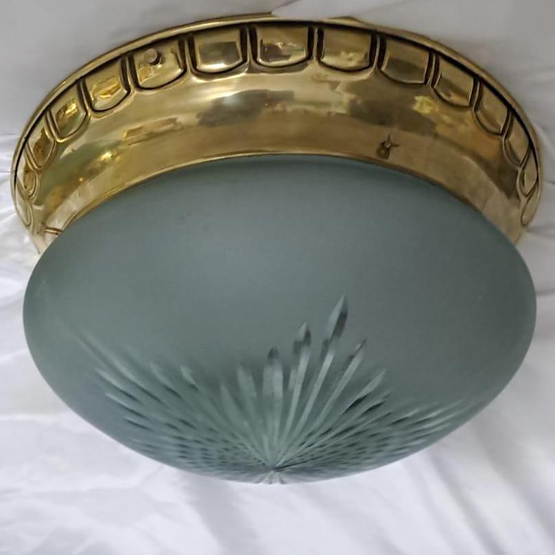 Set of 12 English circa 1940's flush mount light fixtures with frosted glass. Sold individually.

Measurements:
Diameter: 15
