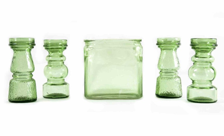 Set of vintage green glasses is an original decorative set of glass objects realized in the 1970s.

Made in Italy. 

Art glass.

The set includes two huge lively green bottles containers and four small bottles realized with two different