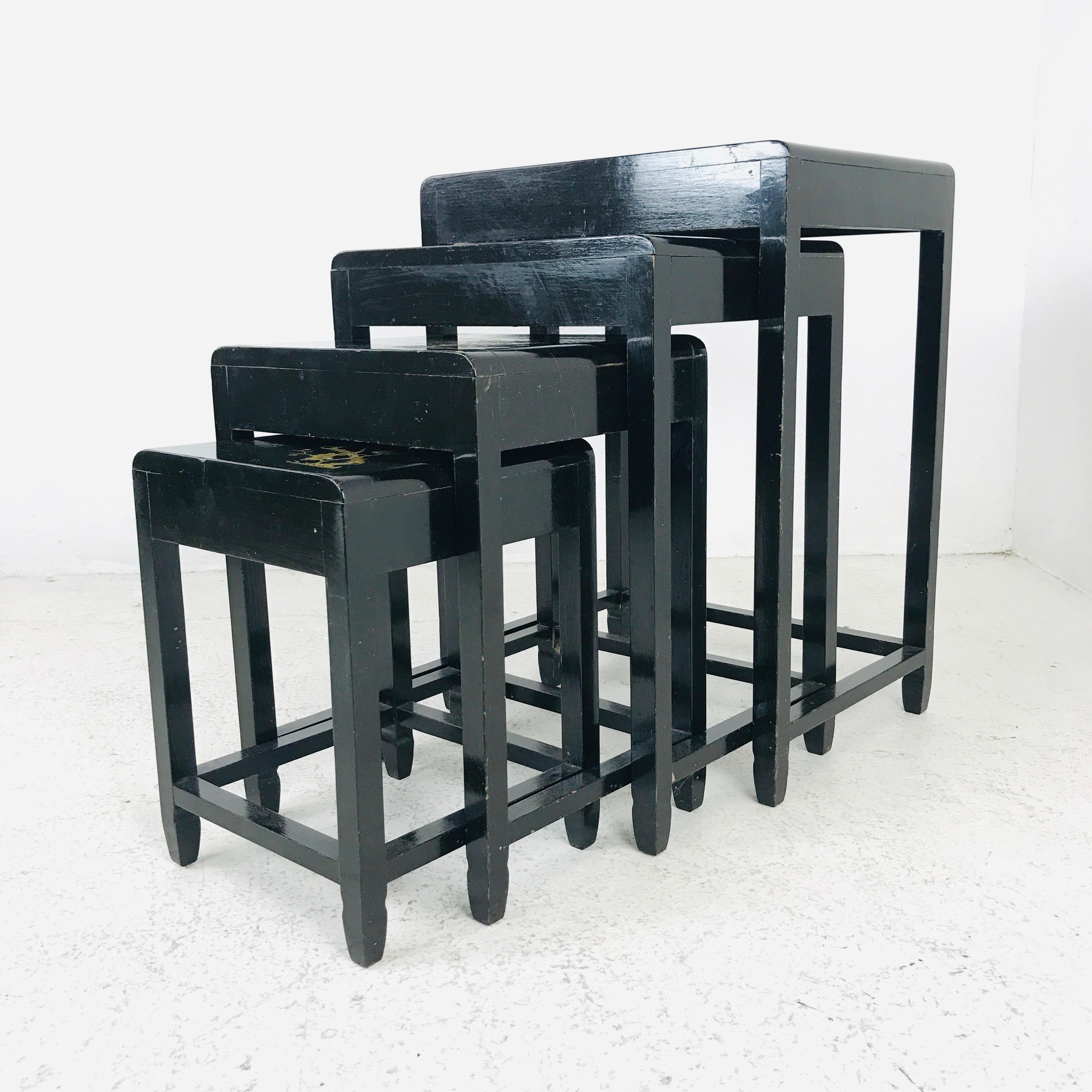 Set of 4 vintage Asian nesting tables with black lacquer and gold inlay.
Measurements are: Large: 18.5