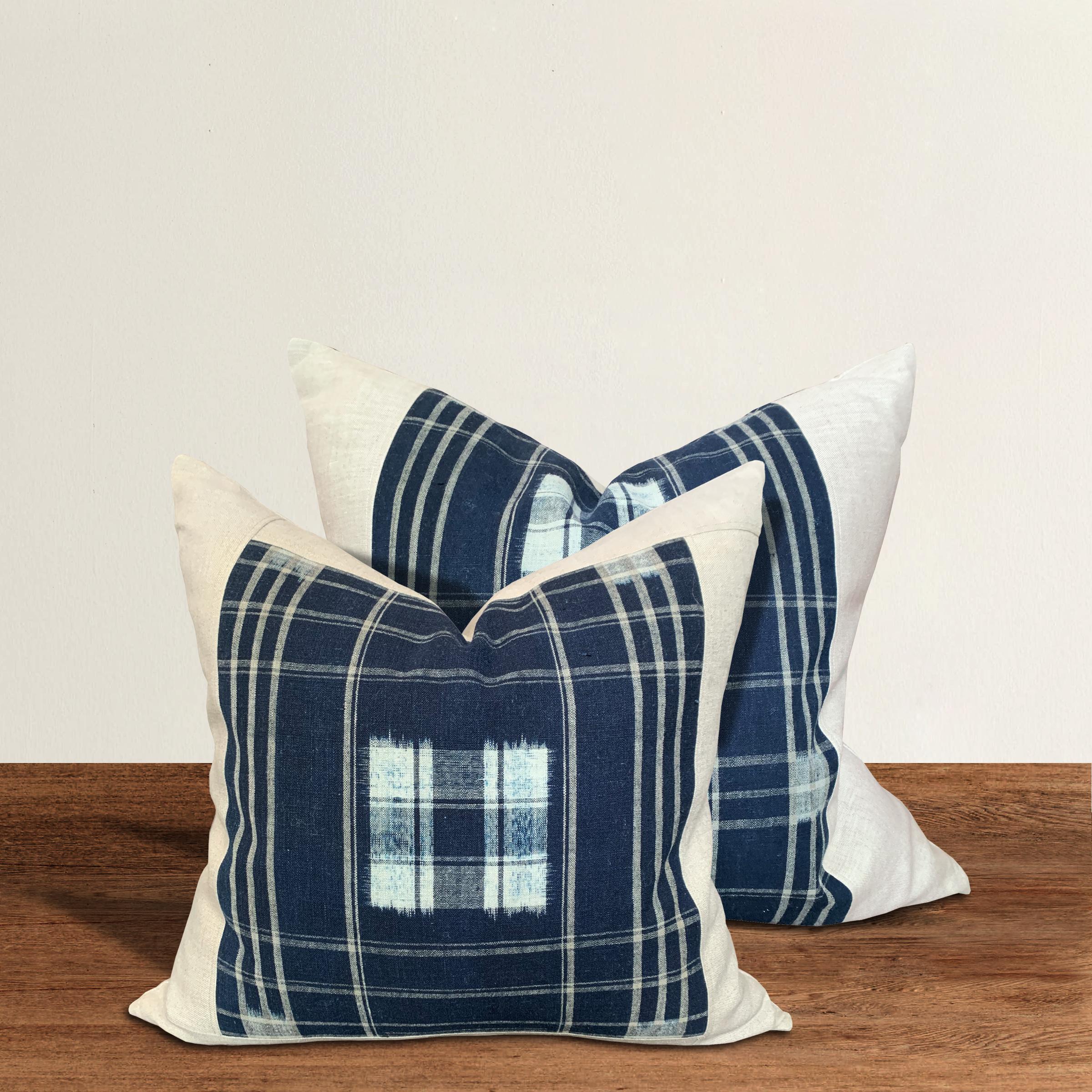 A set of pillows made from vintage Japanese handwoven blue and white indigo with a plaid pattern, filled with down. These pillows are slightly different sizes and slightly different patterns, making them a near pair.

Large: 21 in. W x 20 in.