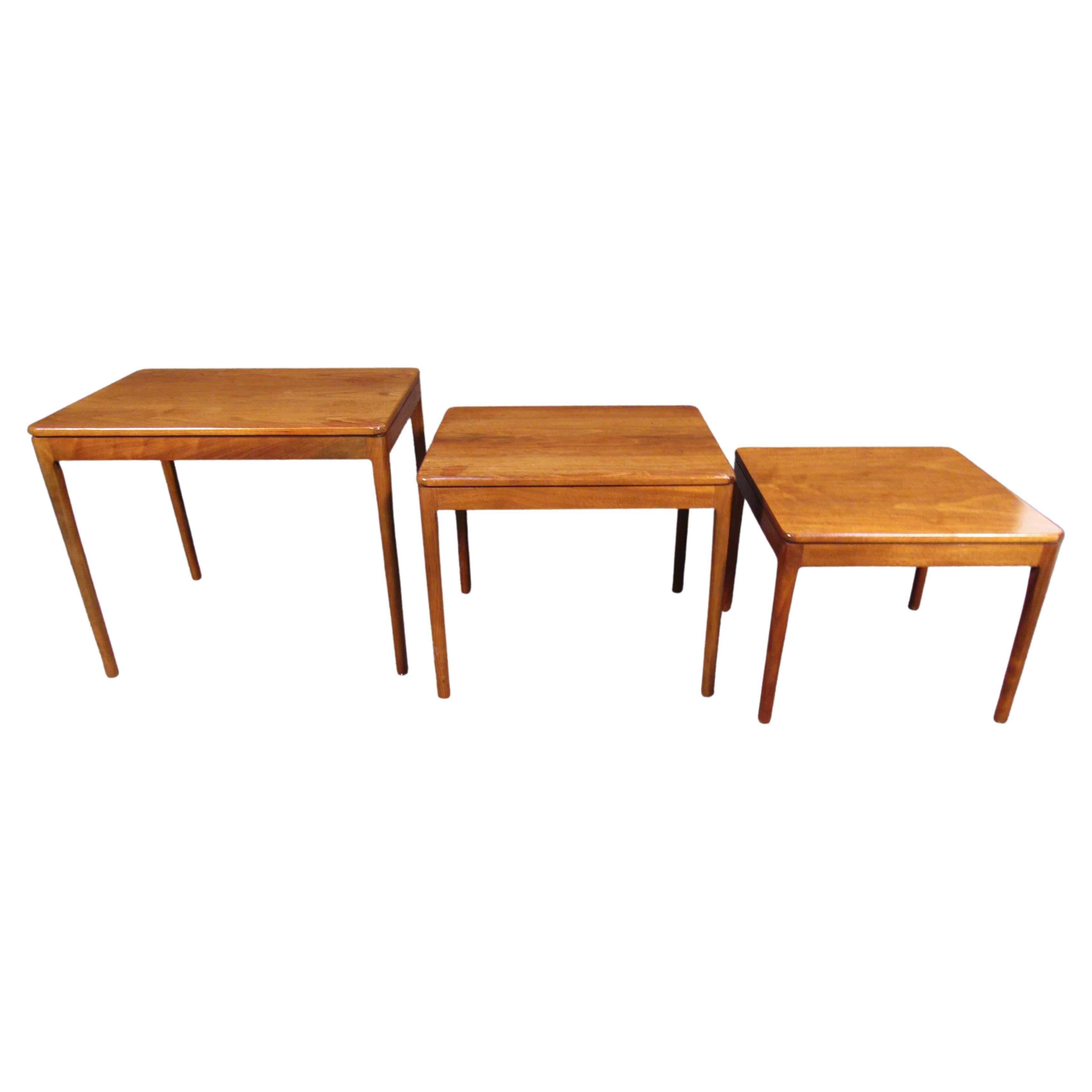 Mid-century American craftsmanship and quality materials make this set of nesting tables by Drexel truly special. Featuring walnut woodgrain and a minimal stacking design. Please confirm item location with seller (NY/NJ).