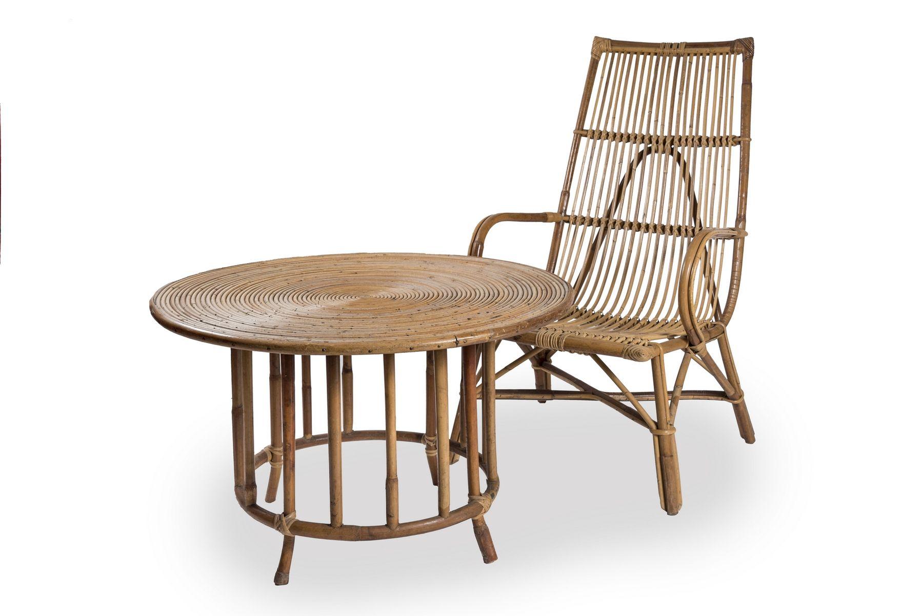 Set of vintage rattan and bamboo furniture comprising three armchairs and a round table, from the 1960s

Comfortable vintage set of furniture consisting of three armchairs with low, wide and high backrests, and a round coffee table with a tabletop