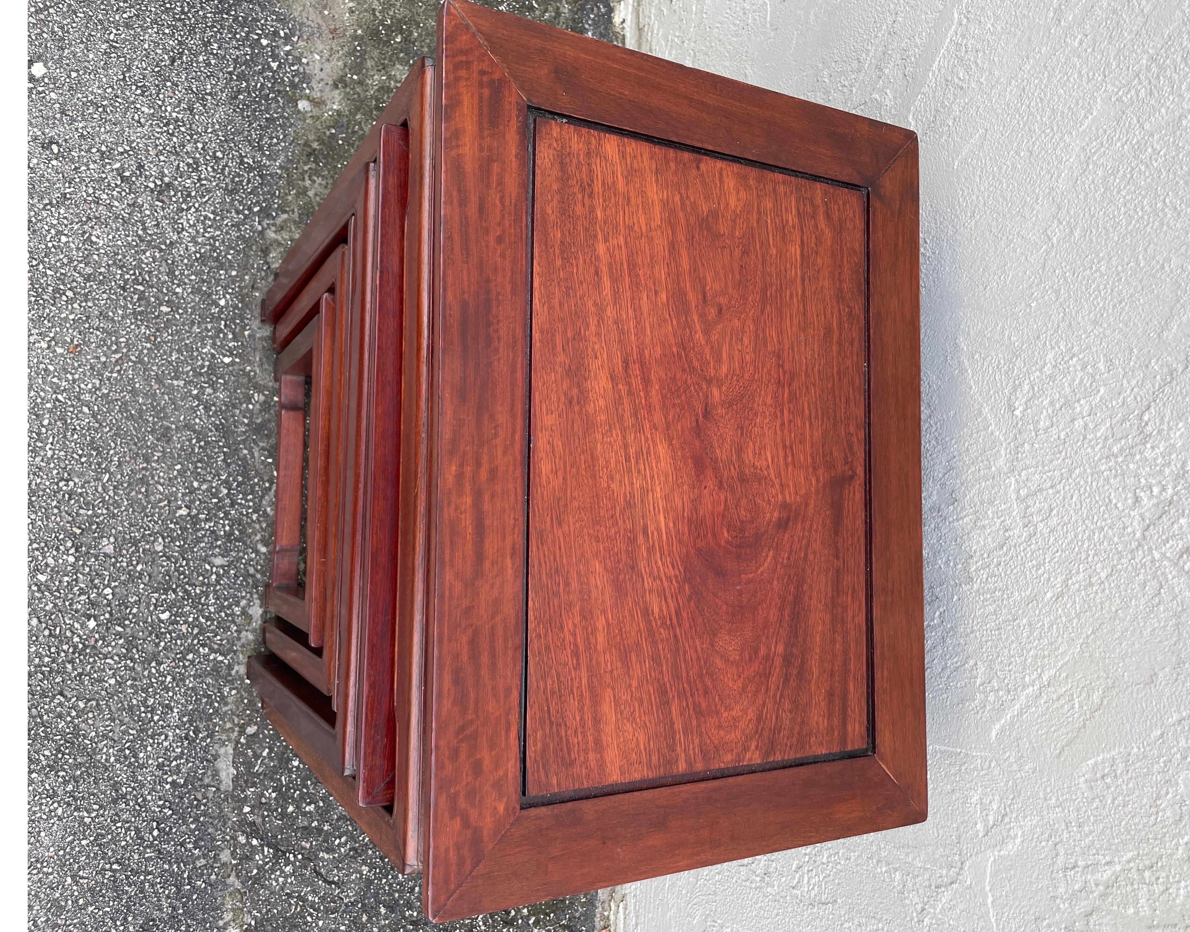 Set of four vintage rosewood Ming style nesting tables. A very simple and elegant design.