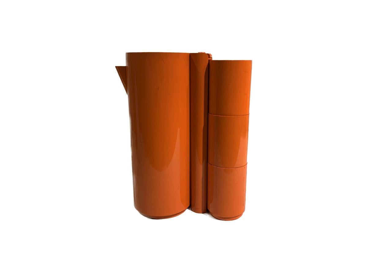 This beautiful vintage orange stackable set is made from ABS plastic. 
Composed of a pitcher, two stirrers, and six cups,, of which all are stackable. 
Very convenient for storage, typical 1970's, and that's what makes the originality and charm of