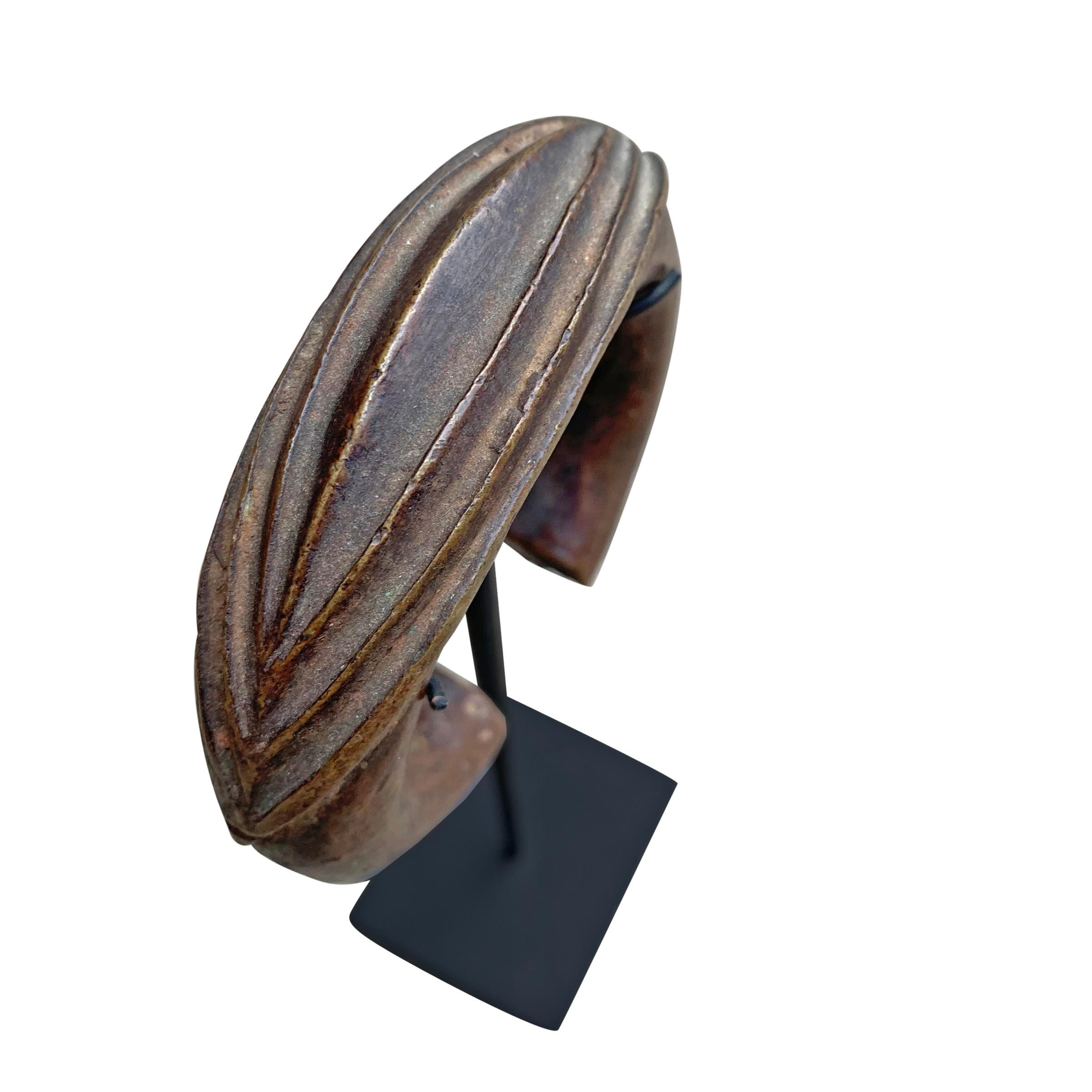 Tribal Set of West African Bronze Currency Bracelets on Stands