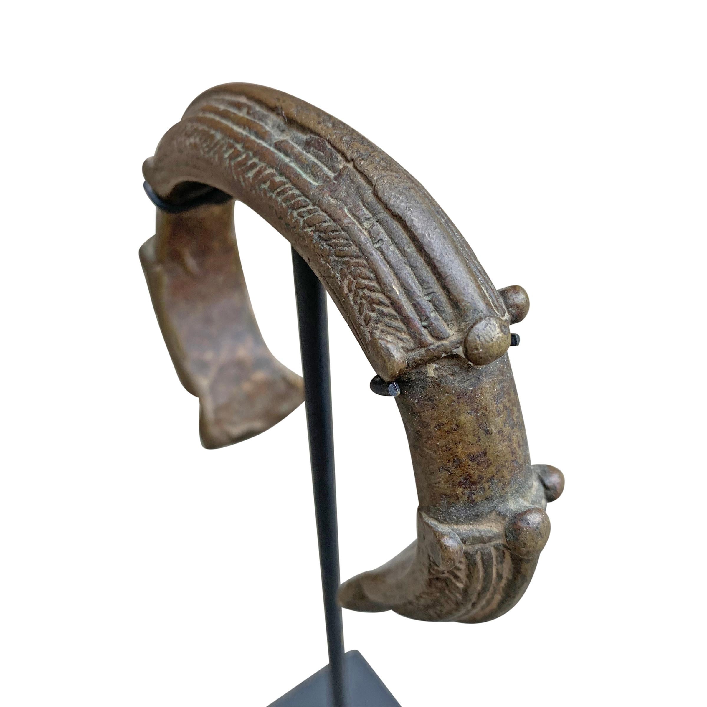 Set of West African Bronze Currency Bracelets on Stands 2