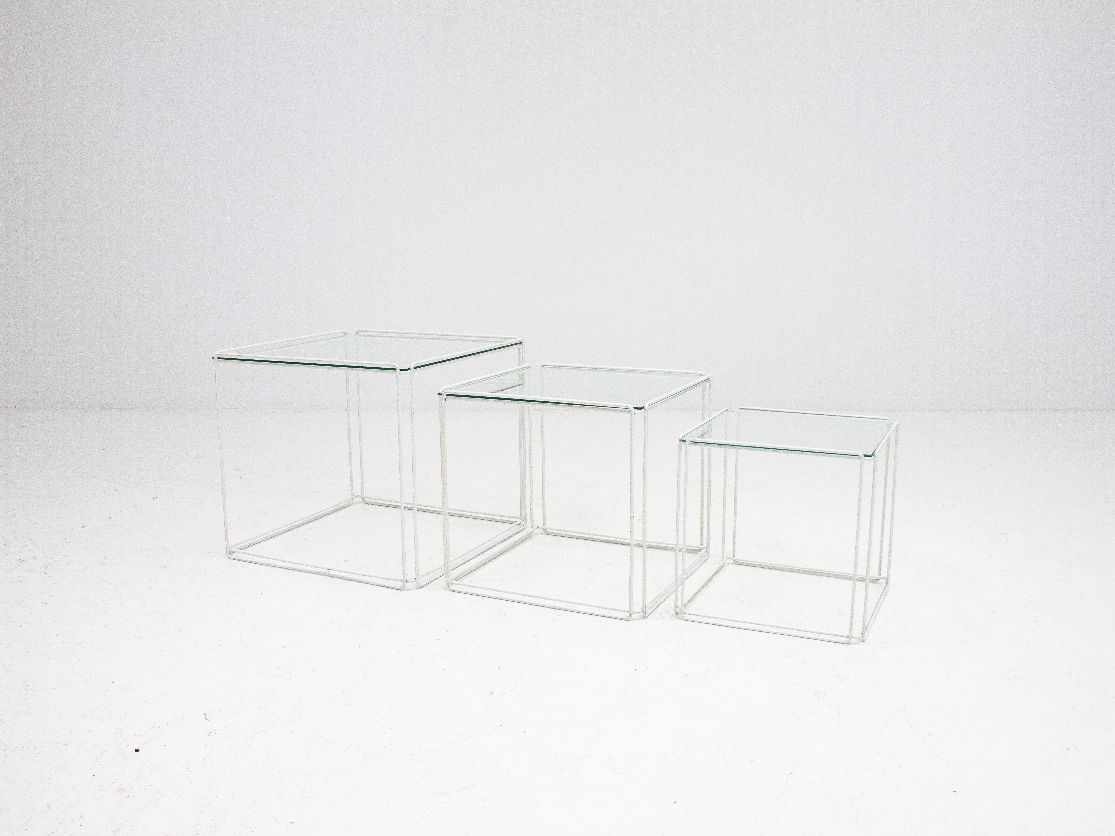 A very well recognized piece of French design by Max Sauze, with white lacquered wireframes and glass tops the 'Isoceles' nest of tables have a very Minimalist graphical appearance.

This piece has medium wear, some small areas of chipped