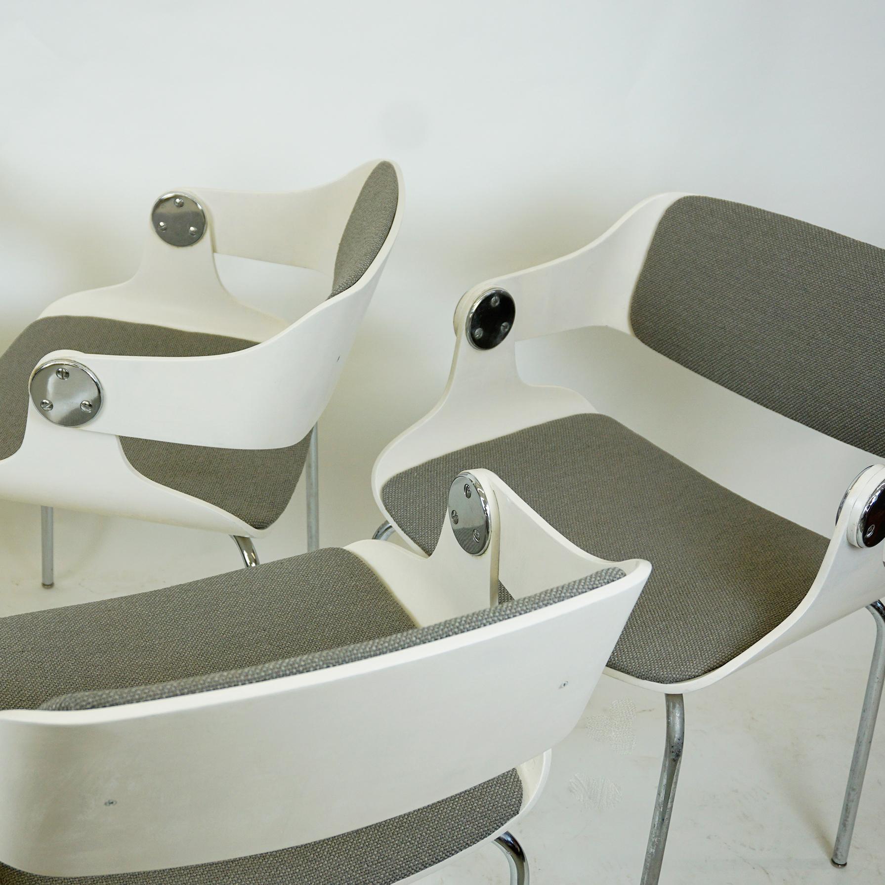 This iconic side chairs from Germany 1960s were designed by Eugen Schmidt for Soloform. They feature chromed steel legs and white lacquered bent plywood seats with newly upholstered grey seats and backs. The chairs are very comfortable and will be