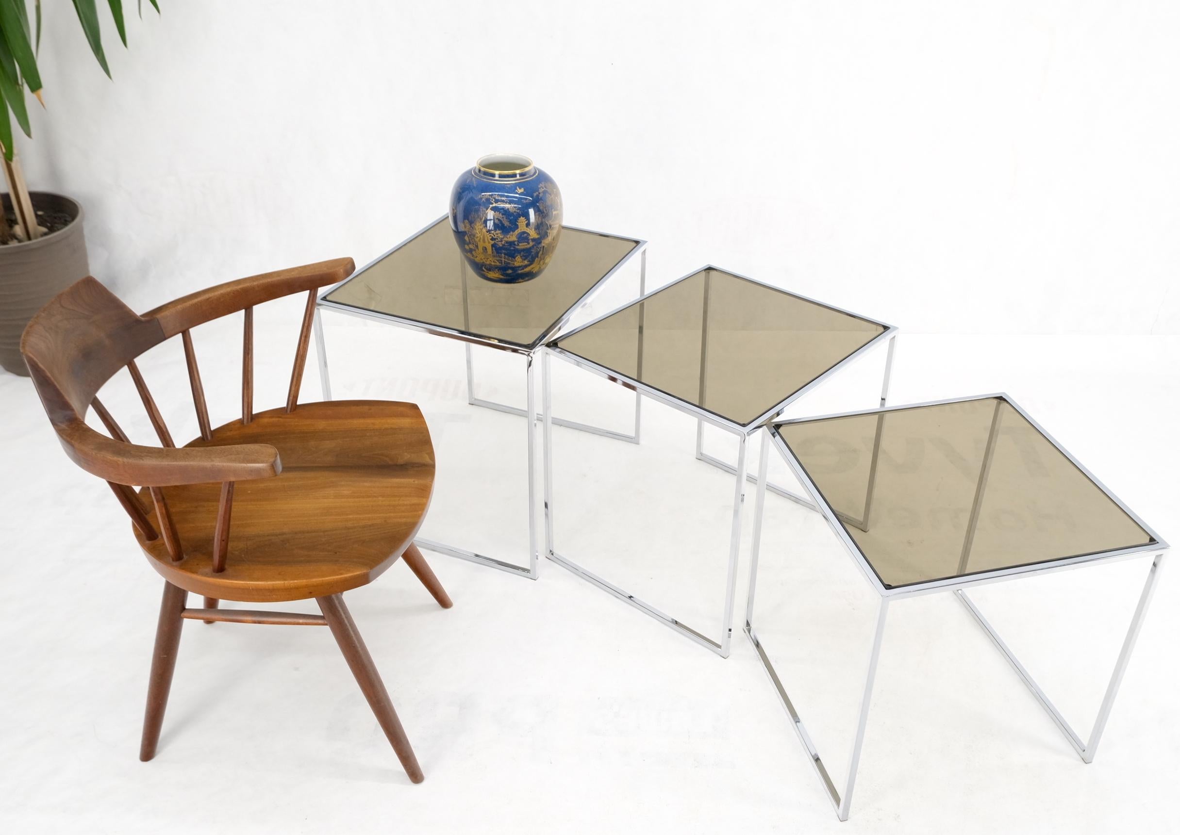 Set of wide rectangle shape chrome & smoked glass nesting end side tables.
Studio made set of Mid-Century Modern occasional tables from the 1970s.