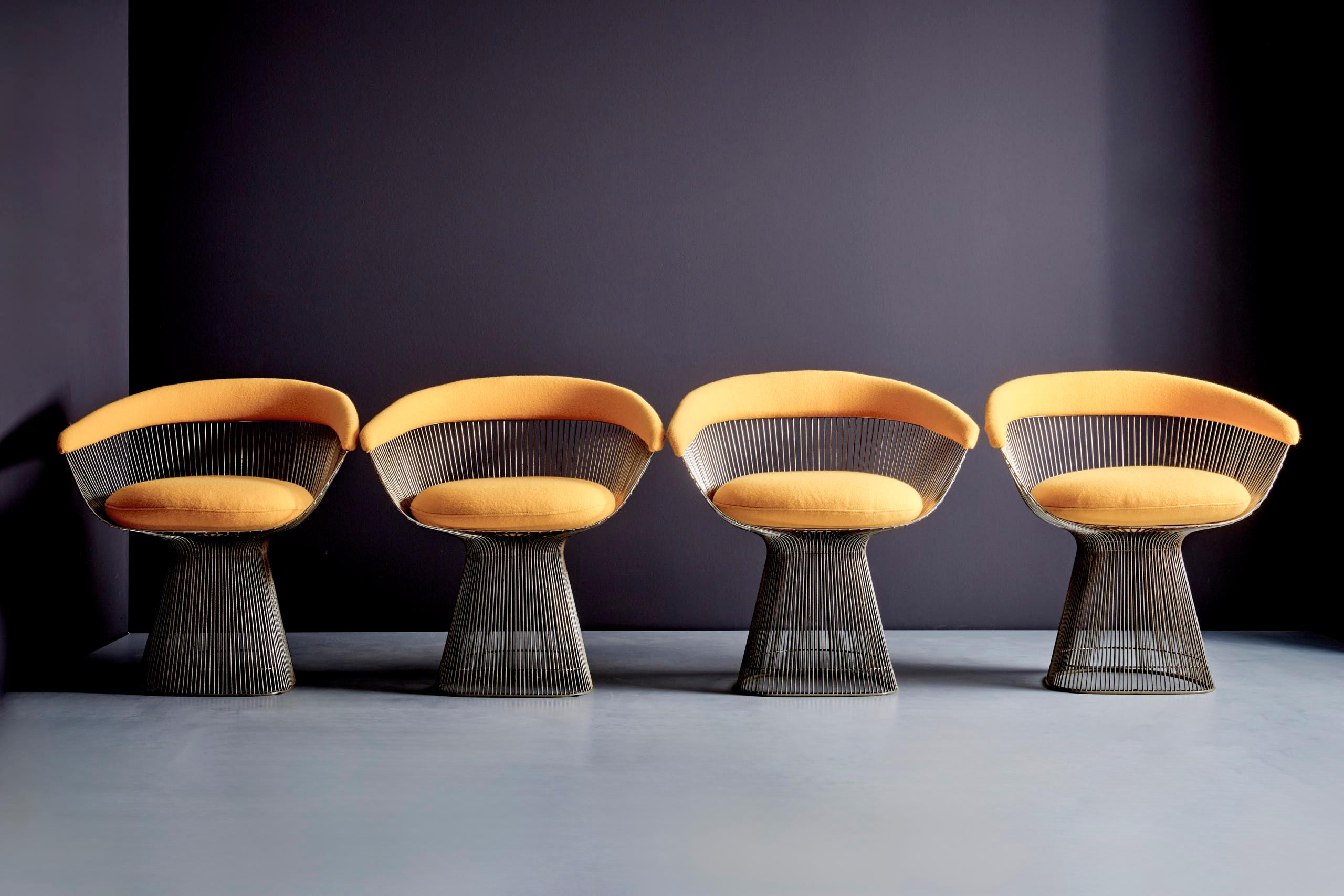 Beautiful early set of dining table with smoked glass top and six matching dining chairs with yellow fabric.
Designed by Warren Platner in the early 1960s and manufactured by Knoll International.
Early production and a design icon of the modern