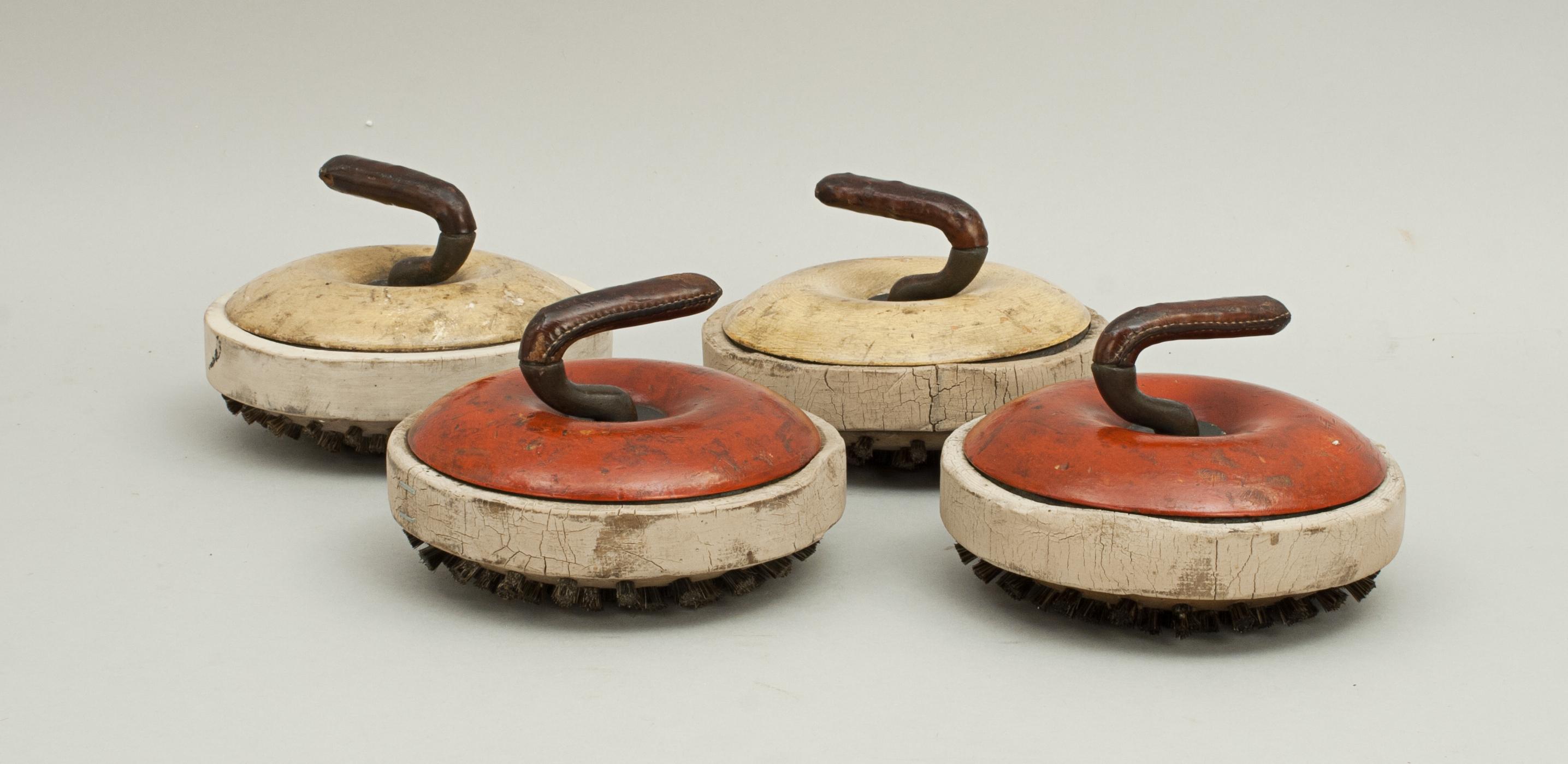 Set of wooden indoor or ships deck curling stones.
Four rare and unusual miniature wooden curling 'stones'. The 'stones' are made of two halves of wood that encase a ring of cast iron, this gives weight to the stone. Each curling stone is fitted