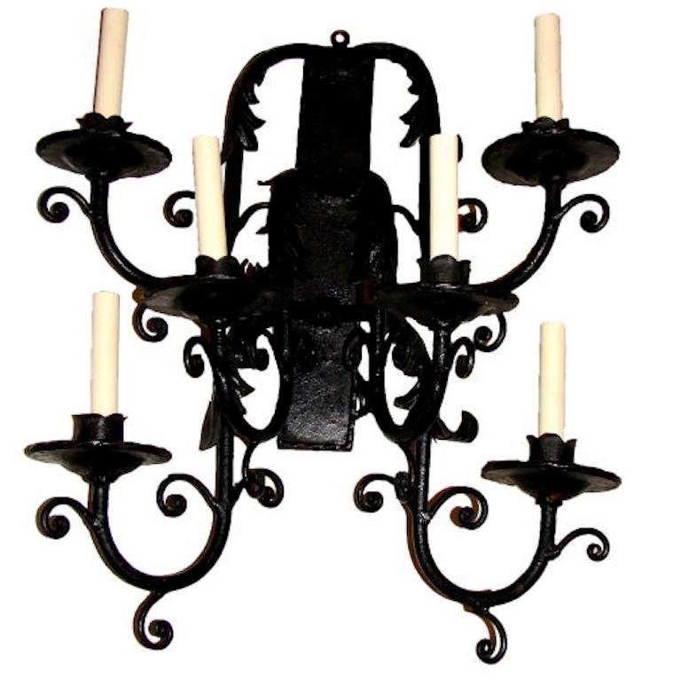 Set of four circa 1920s French wrought iron sconces with six lights each. Sold per pair.

Measurements:
Height 24.5