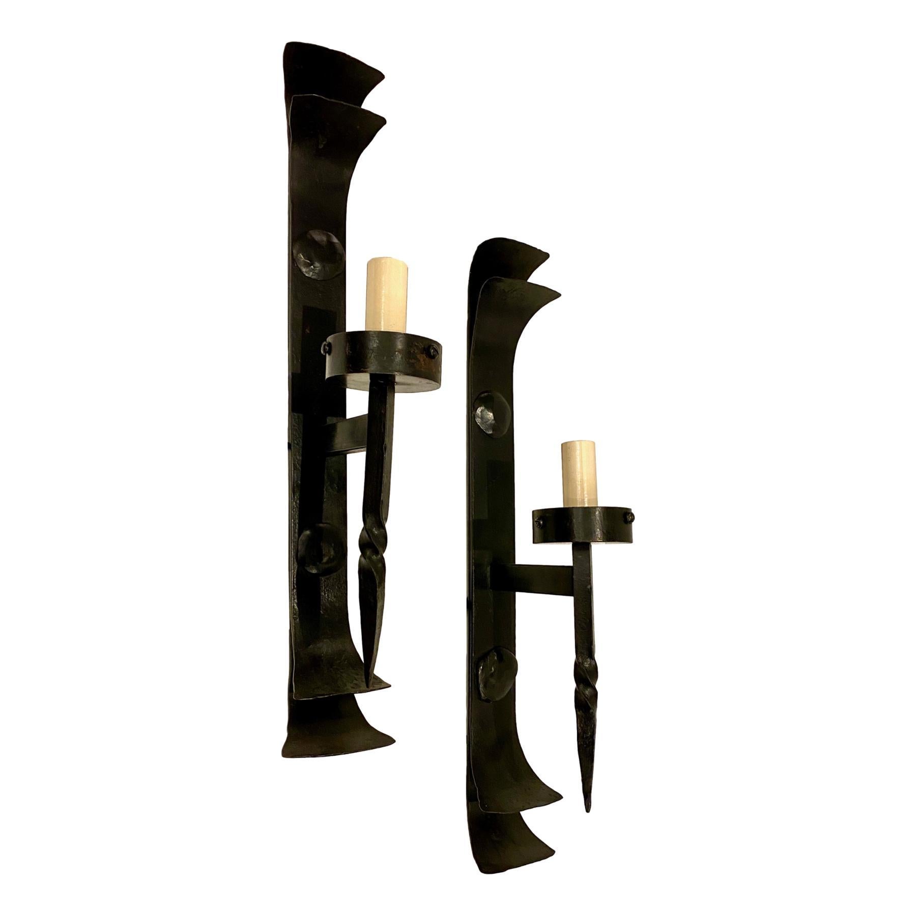 Set of 4 Italian circa 1950's single-light wrought iron sconces. Sold per pair.

Measurements:
Height:18