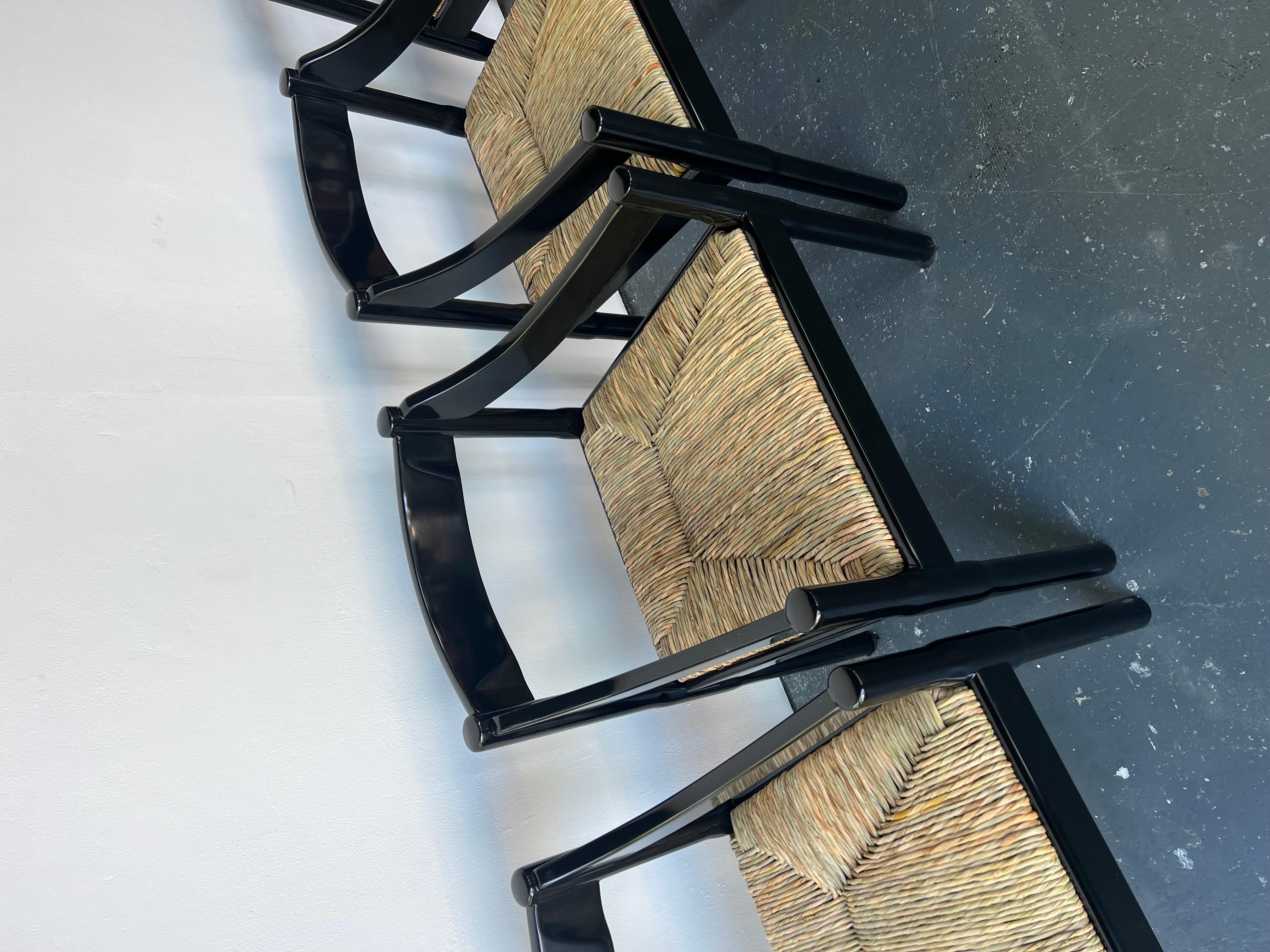 Set of x2 Glossy Black Carimate Carver Chairs by Vico Magistretti

The Carimate chair was born when Vico Magistretti (1920-2006) was conceiving designs for seating at the Carimate golf club in Italy in 1959. The design, which combines traditional