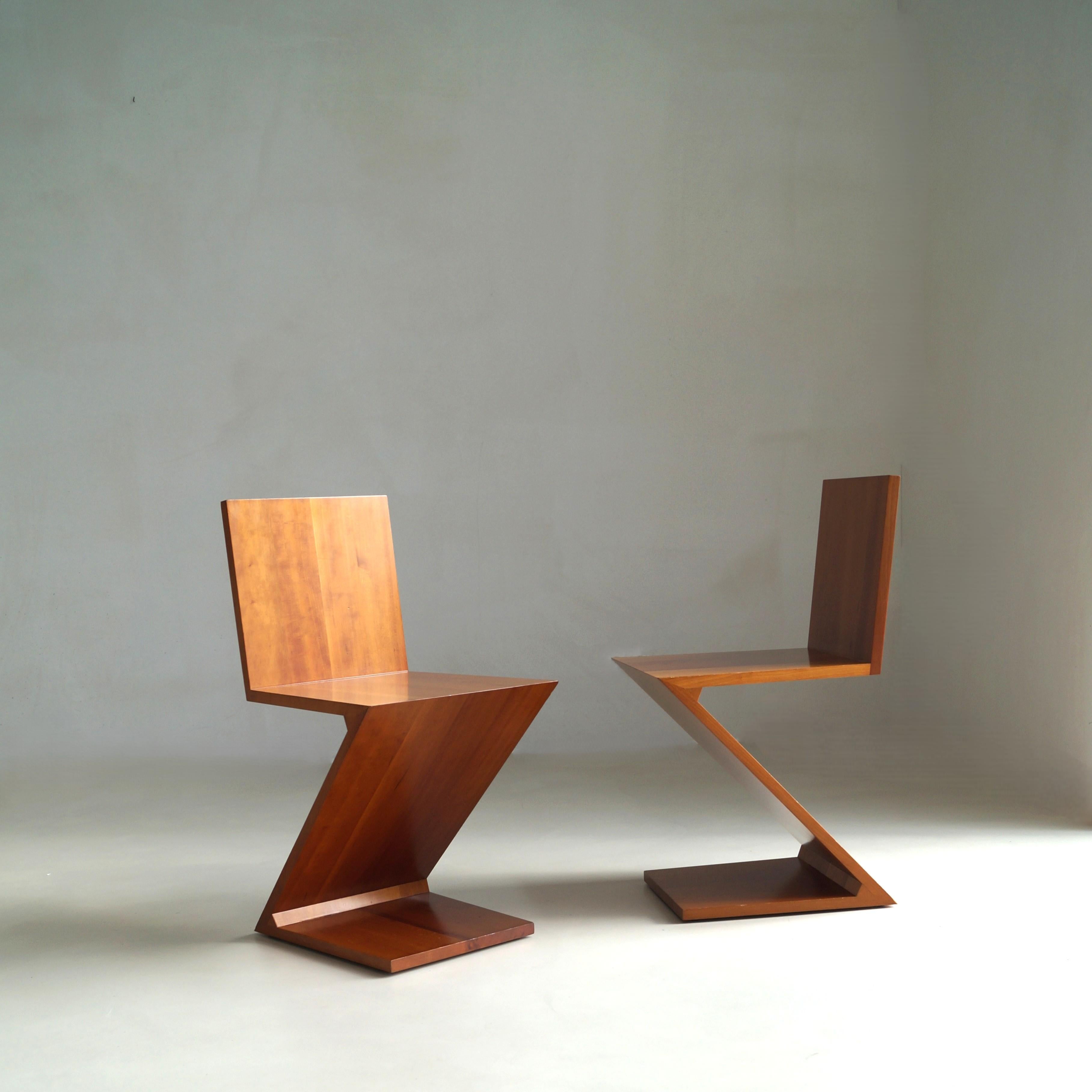 A pair of vintage 1980s Cassina “Zig-Zag” chairs in cherry wood, marked underneath and numbered consecutively (2981, 2982). The set comes from the first owner and has been very well cared for. They are structurally in perfect condition with no