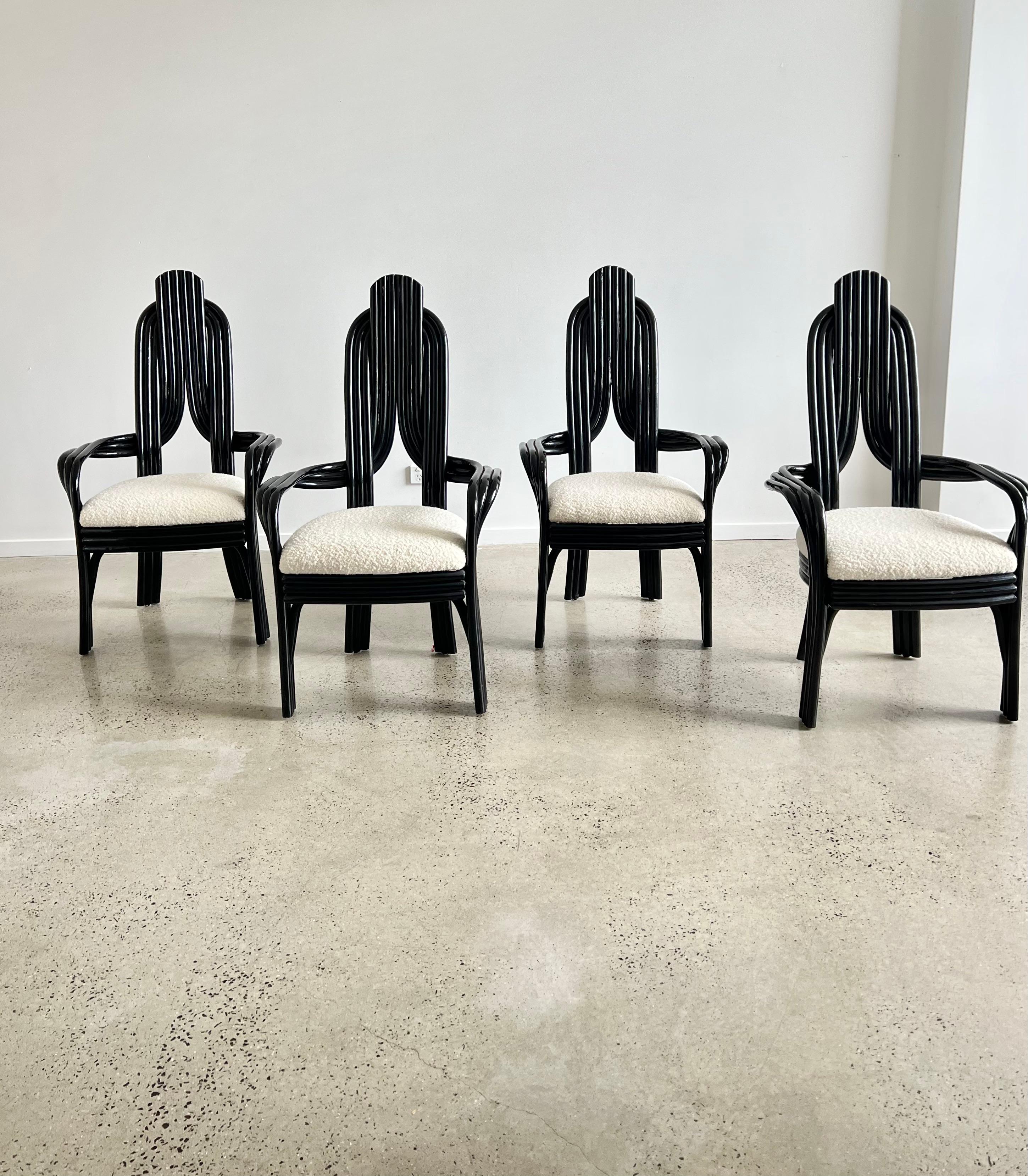 Unique set off four sculptural and confortable black lacquered Bamboo dining chairs, seats reupholstered with sheep skin.