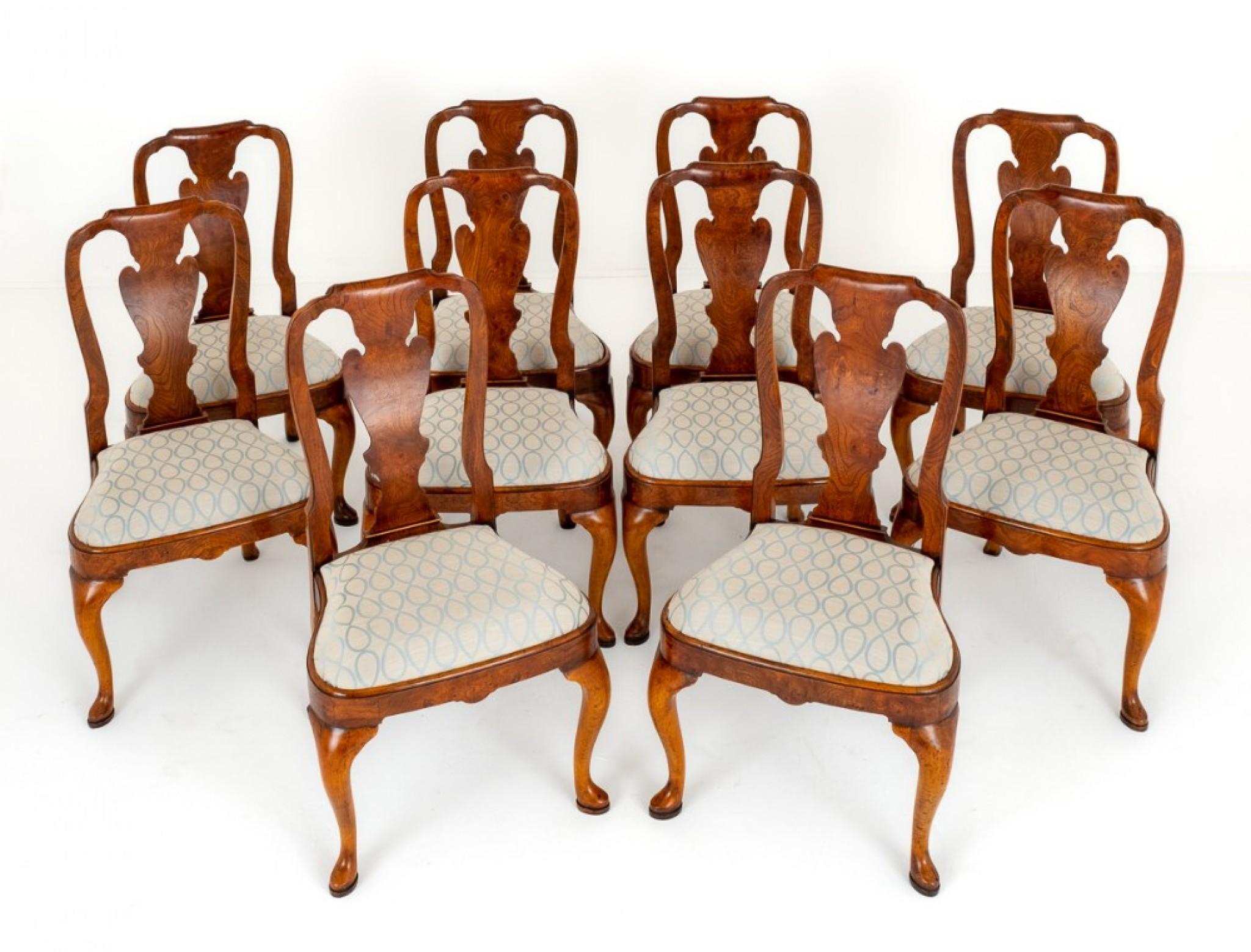 Set of 10 Queen Anne Style Elm dining chairs.
circa 1920
These chairs stand upon cabriole front legs with pad feet and swept backs.
Having recently reupholstered lift out seats.
The back splat being of a typical queen anne form with a shaped