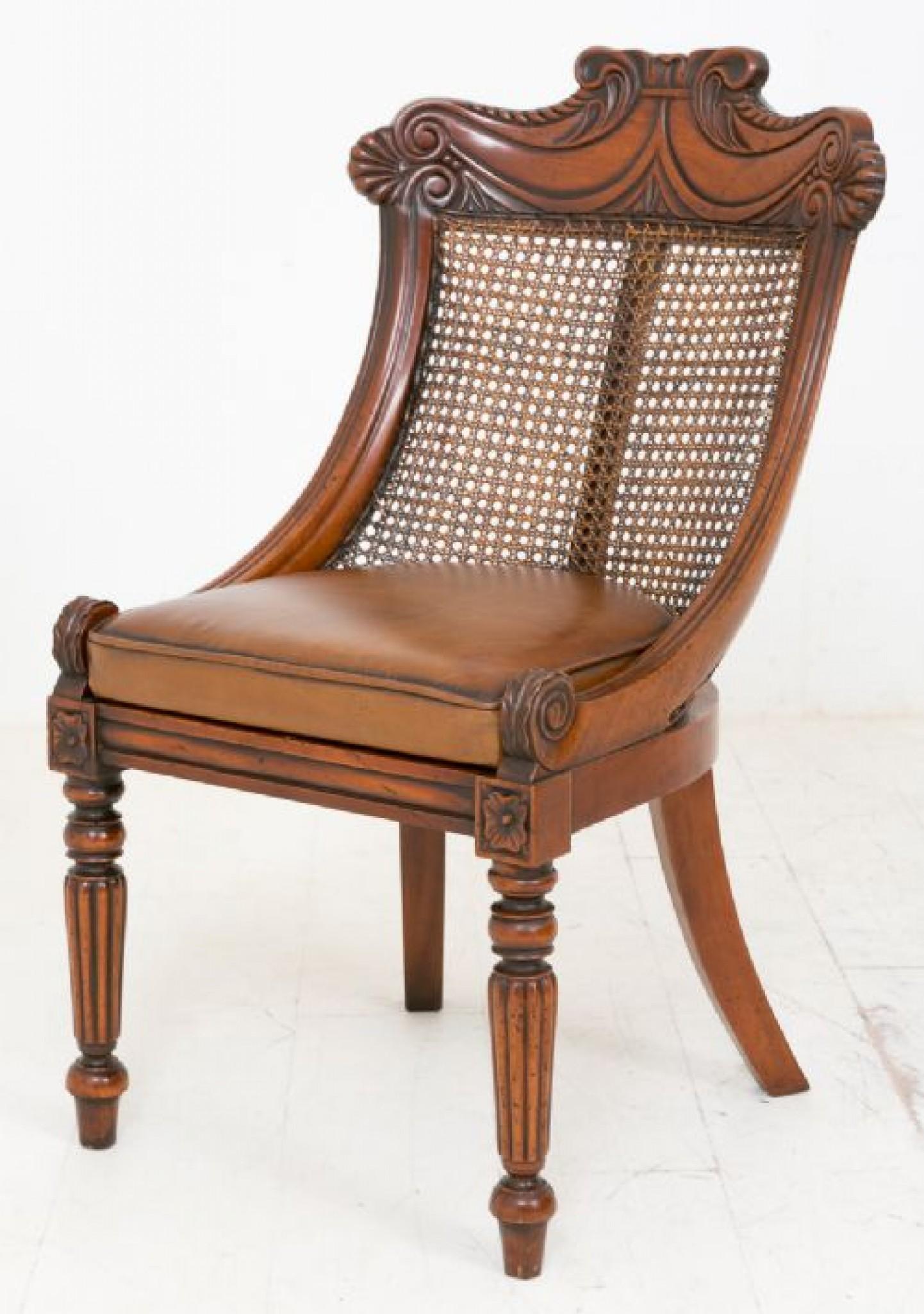 Wonderful Set of 15 Mahogany Regency Style Chairs.
These Chairs stand Upon Crisply Ring Turned and Fluted Front Legs with Sabre Rear Legs.
The Lift out Seat Cushions have Recently been Reupholstered in a Quality Hide.
The Chairs Feature Cane