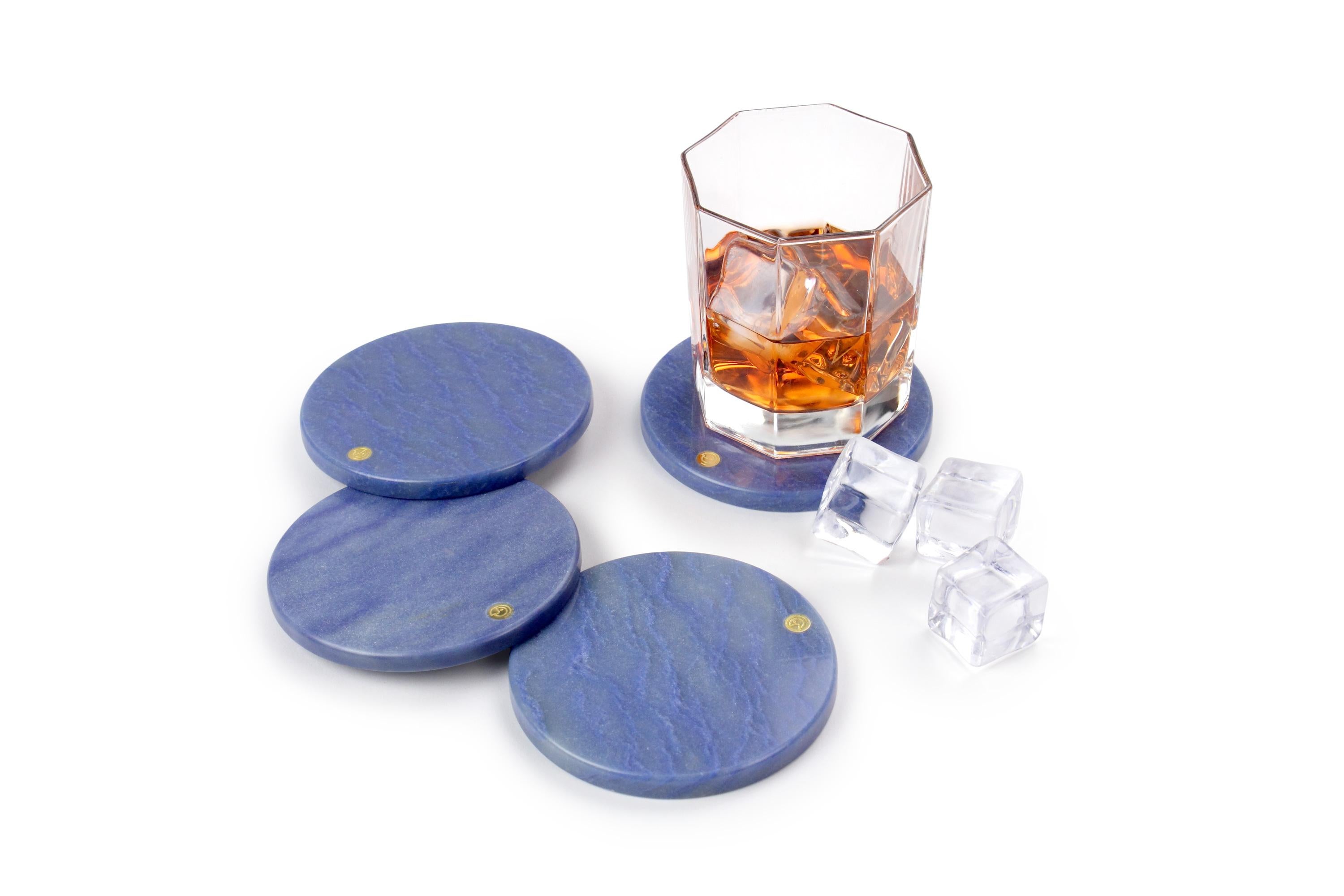 Set of 4 coasters in Azul Macaubas.
Thanks to their shape and size they can be used as exclusive presentation plates for finger food.

Dimensions: D 10, H 0.8 cm
Also available: Square L 10, W 10, H 0.8 cm
Available in different marbles, onyx and