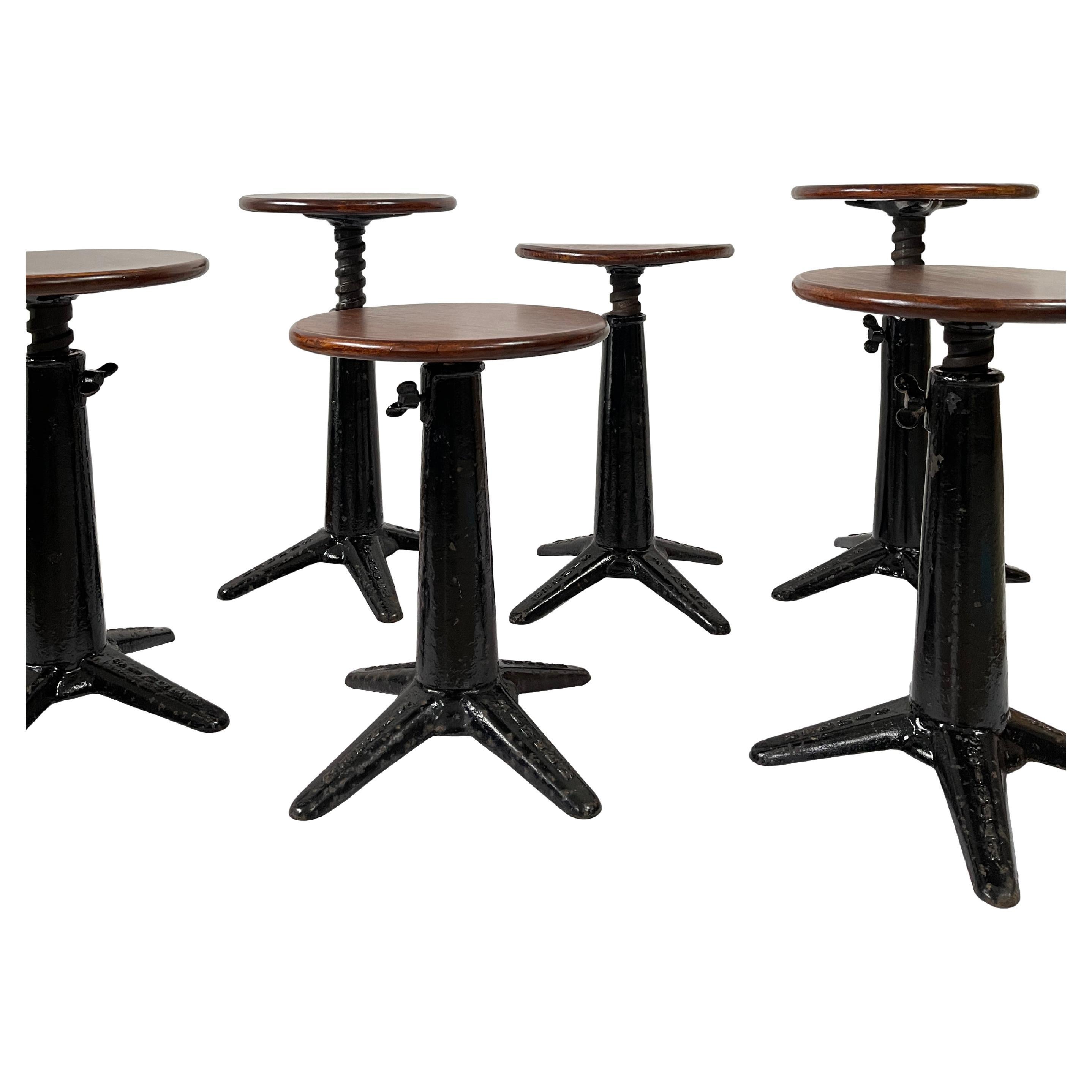 - A fabulous run of 5 original Singer sewing stools, English circa 1930.
- Heavy industrial construction featuring die-cast iron bases that hold a swivel mechanism to adjust the seating height, all with original wing nuts.
- Beautiful condition,