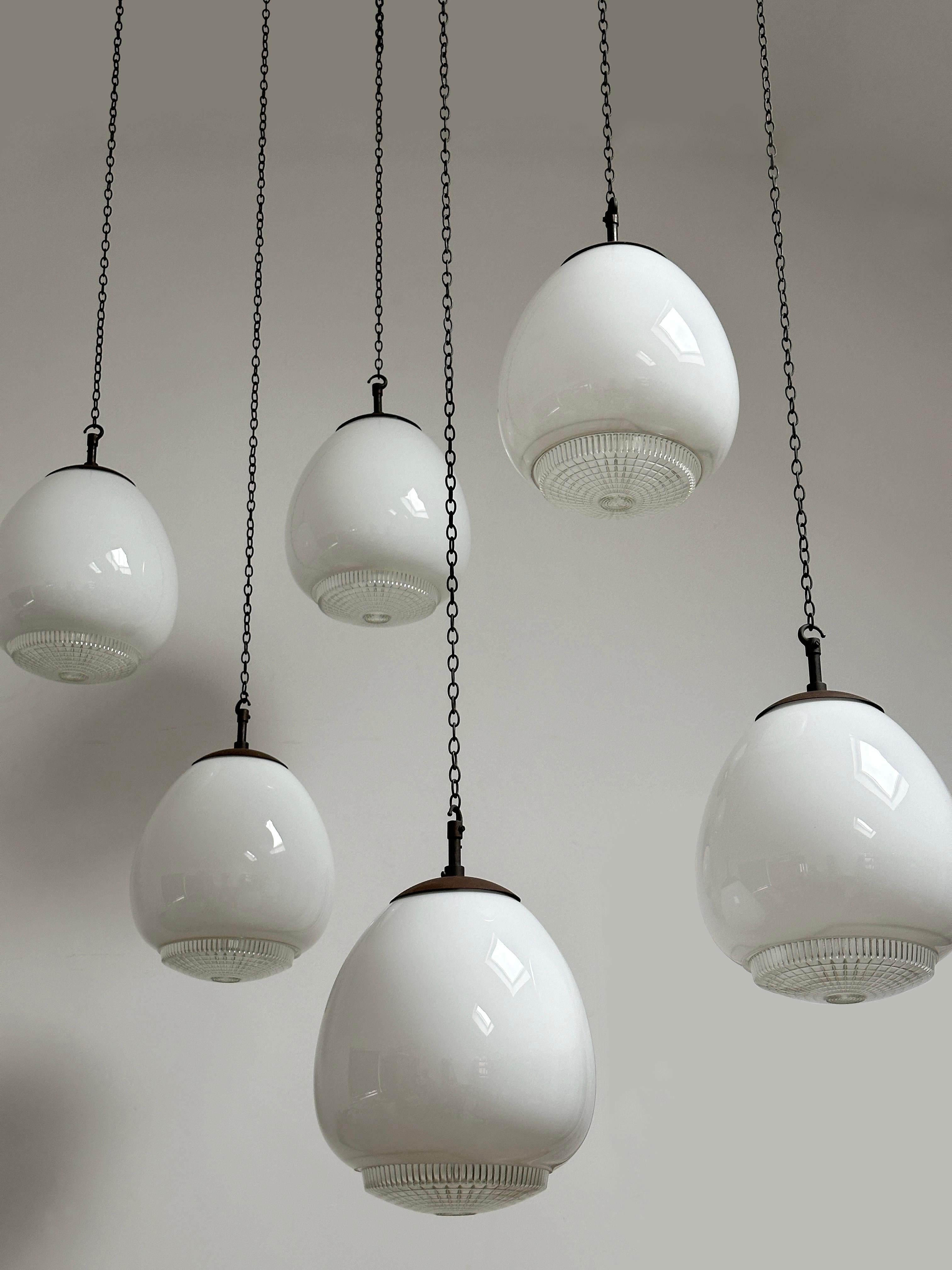 - A beautiful set of tulip shaped diffused opaline ceiling pendants made by Sunglow, England circa 1930.                                   
- Opaline glass shade made and stamped by Hailwood & Ackroyd 'H&A', incorporating the original and rarely