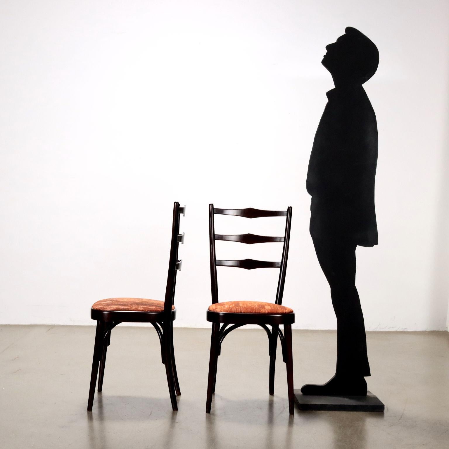 Vintage dining chairs with stained wood frame and refurbished seat with rust-colored fabric. Restored.