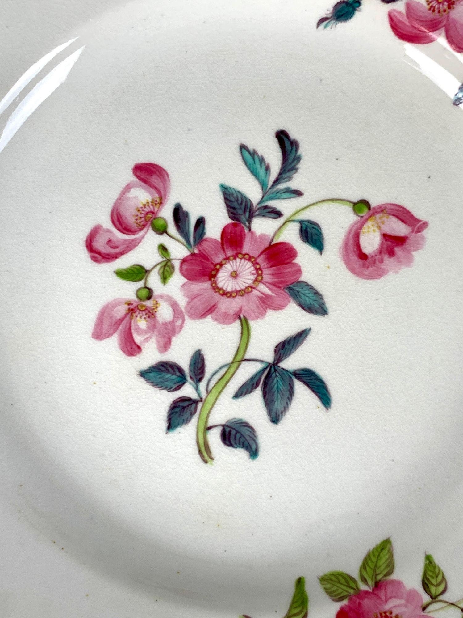 These lovely dishes were made in England around 1815.
They have hand-painted pink roses on bright white Derby porcelain, complemented by green and turquoise leaves.
During the late 18th and early 19th century, flower painting was a popular style for
