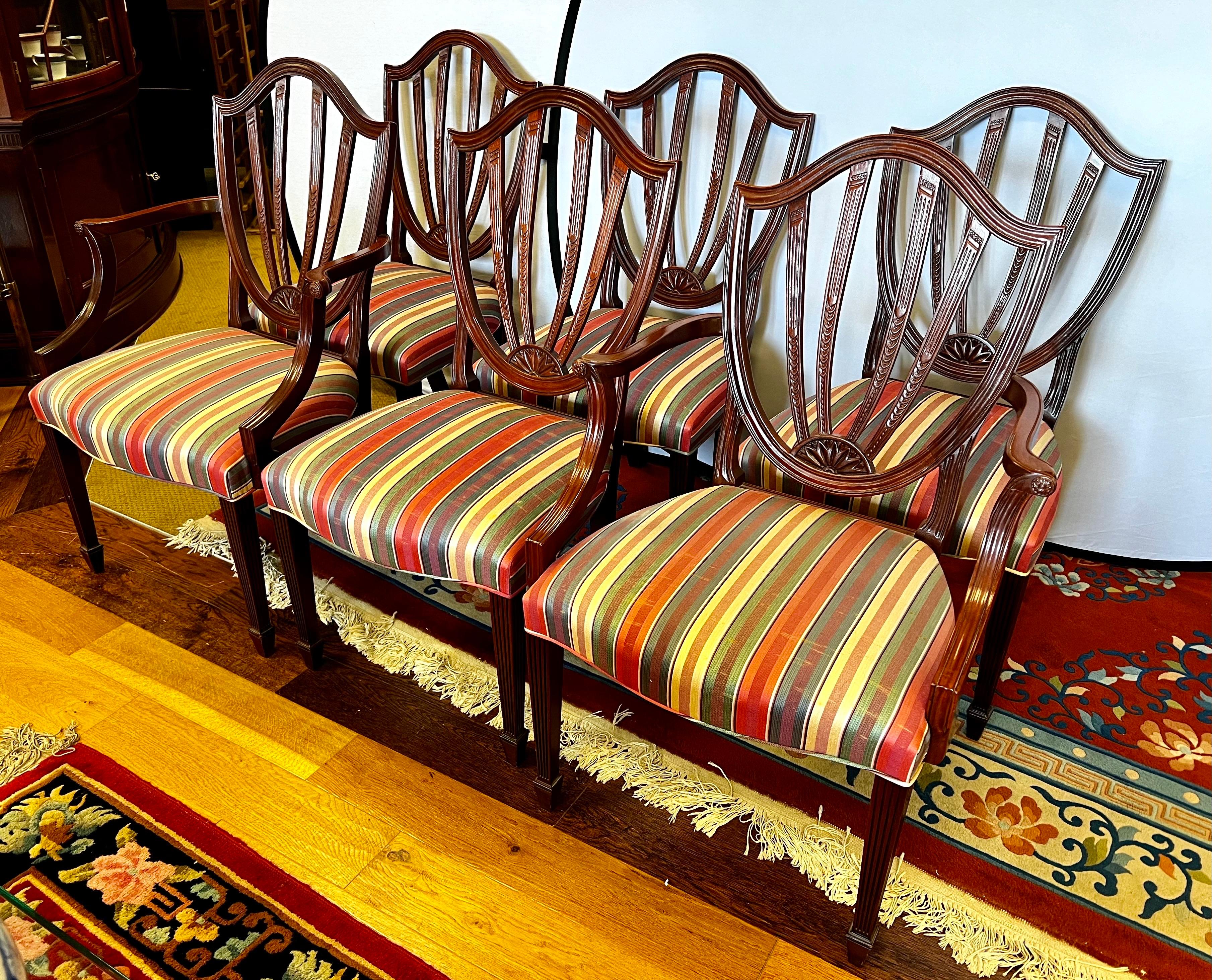 Elevate your home with this exquisite set of six signed Baker Furniture, Historic Charleston chairs.  Each chair features a beautifully shaped back, comfortable upholstered seat, and sturdy cabriole legs that exemplify Baker's commitment to quality