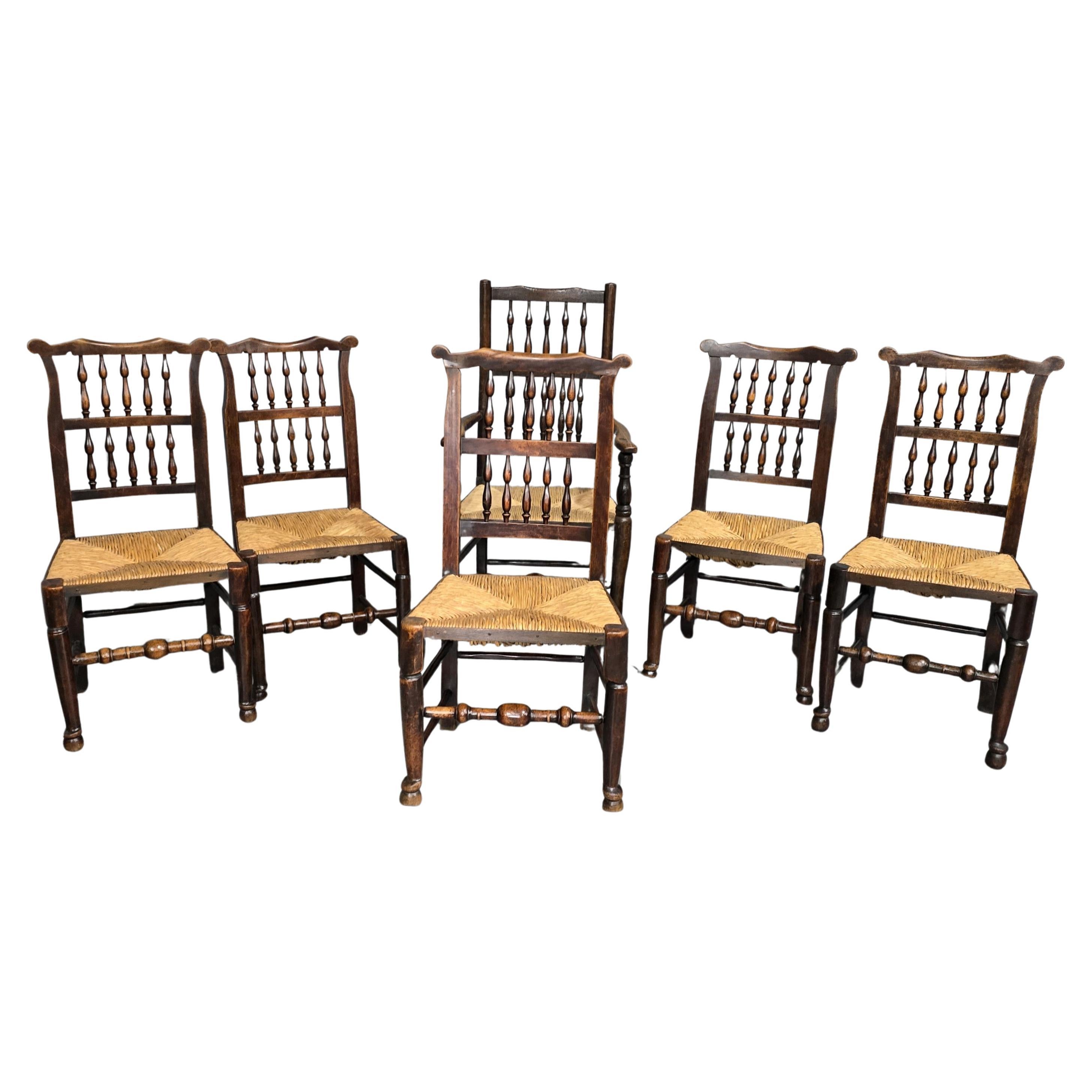 Juego de seis sillas de comedor con respaldo de escalera del siglo XIX en venta