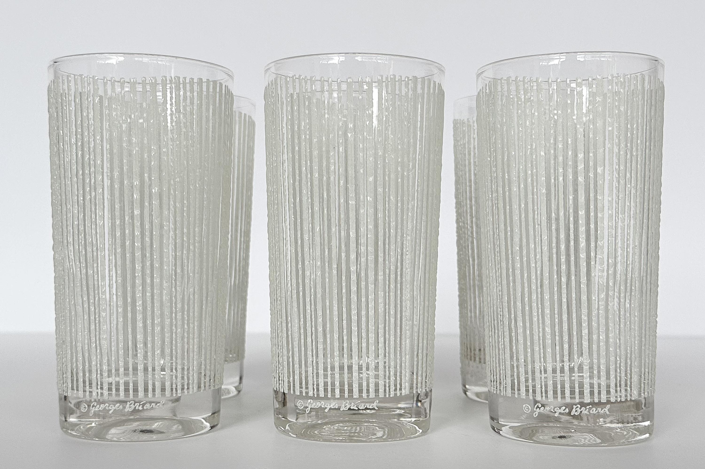 Discover the epitome of cocktail sophistication with this set of six mid-century modern Georges Briard “icicle” pattern highball glasses in white. The 