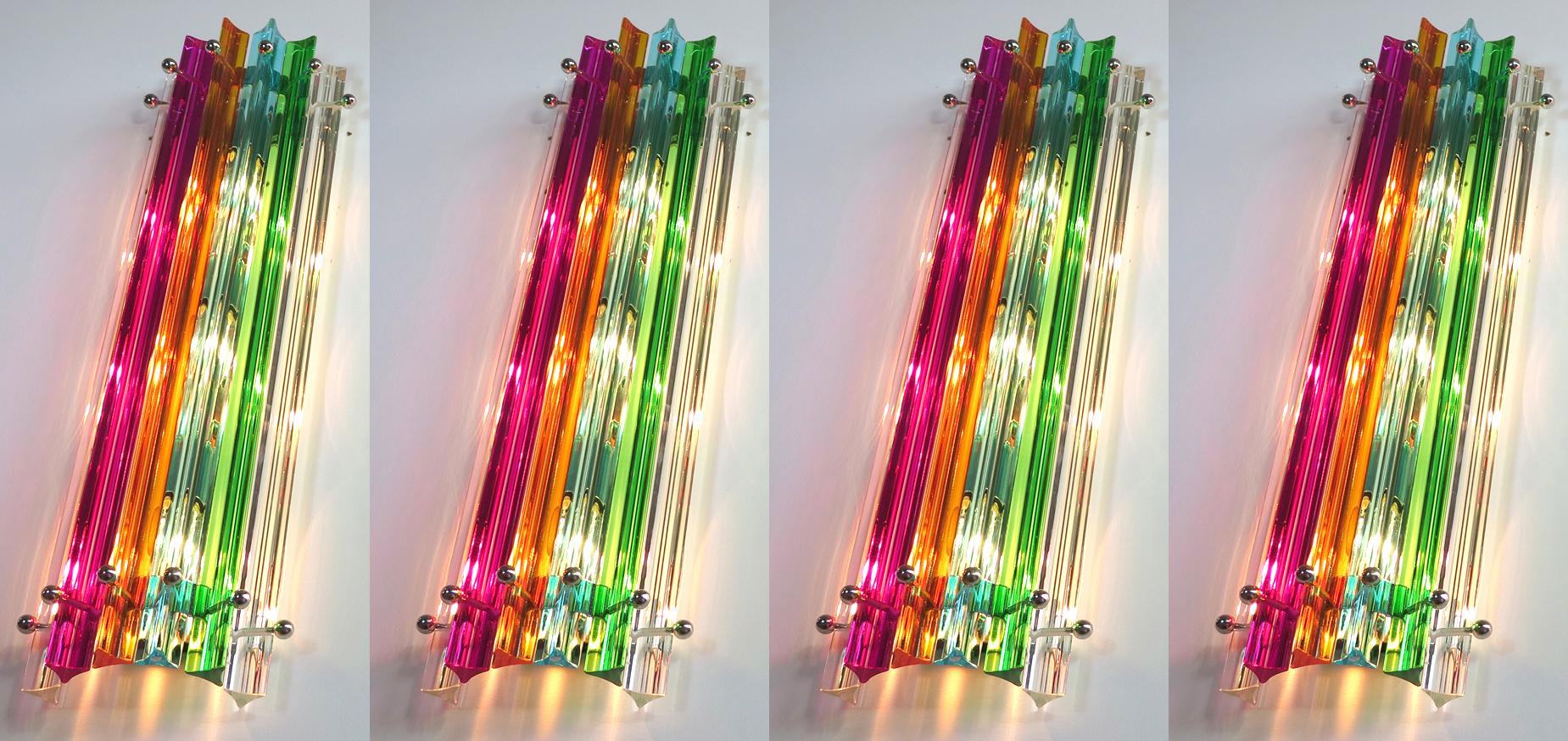 Set six vintage Murano wall sconces, multi-color triedri, Column Mariangela model
Fantastic Pair of vintage Murano wall sconce made by 6 Murano crystal prism (triedri) for each applique in a chrome metal frame. The shape of this sconce is column.