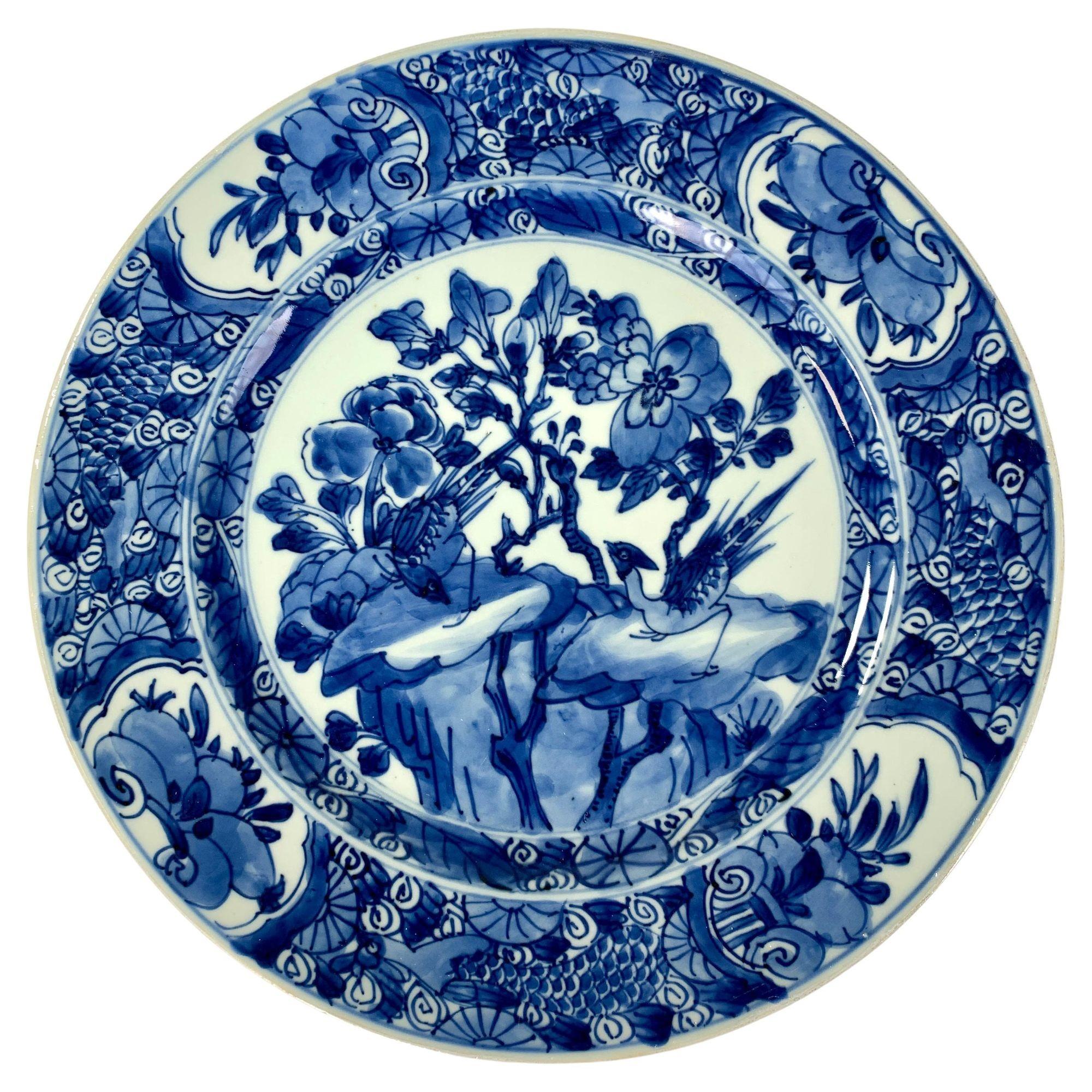 This set of six blue and white Chinese porcelain dishes was hand-painted 300 years ago, circa 1700, during the Kangxi dynasty. According to Sir Harry Garner, author of Oriental Blue and White, 