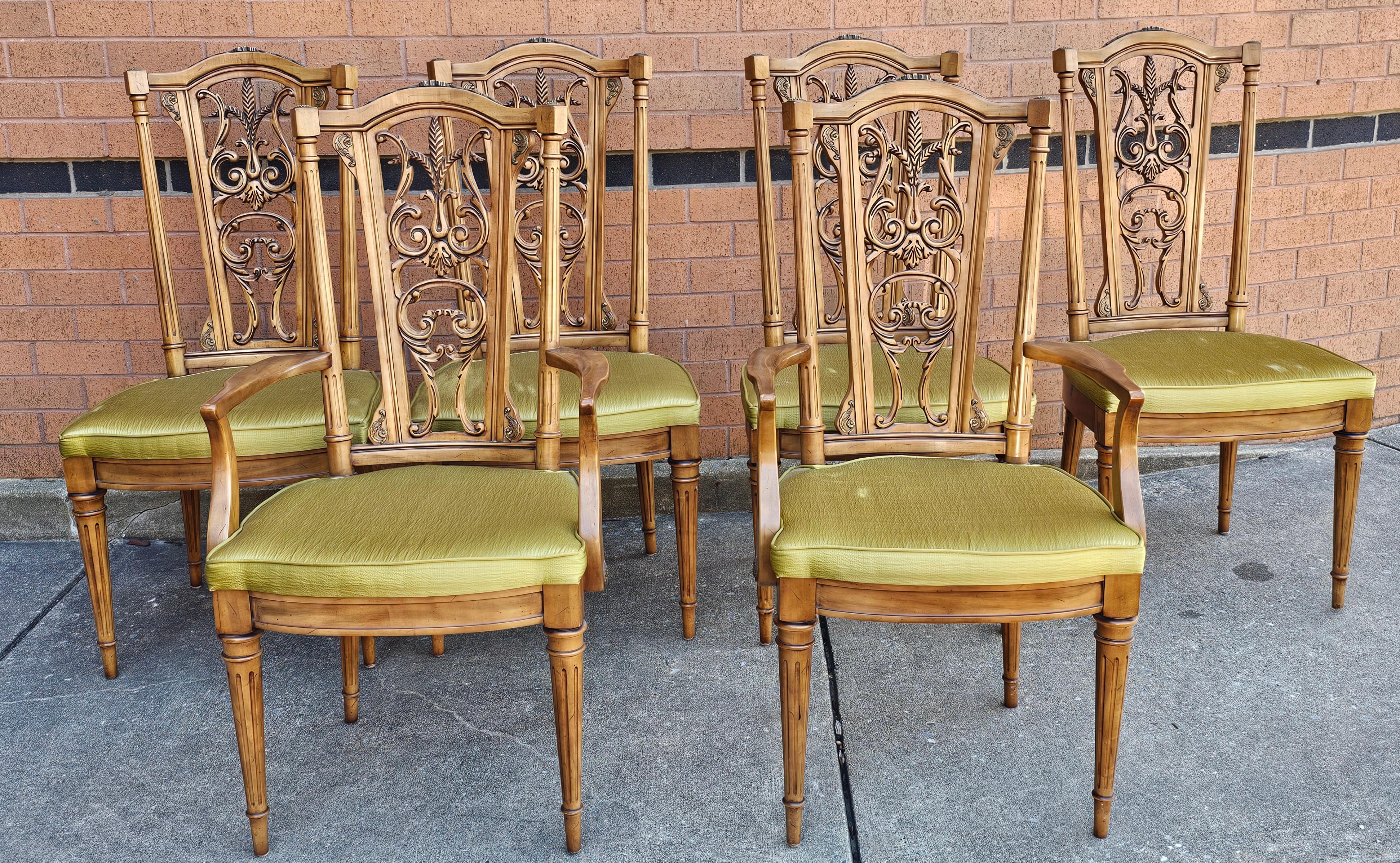 Set of six Louis XVI Style Brass Mounted French Walnut upholstered dining chairs. Four side chairs and two captain chairs. Measures 20.5