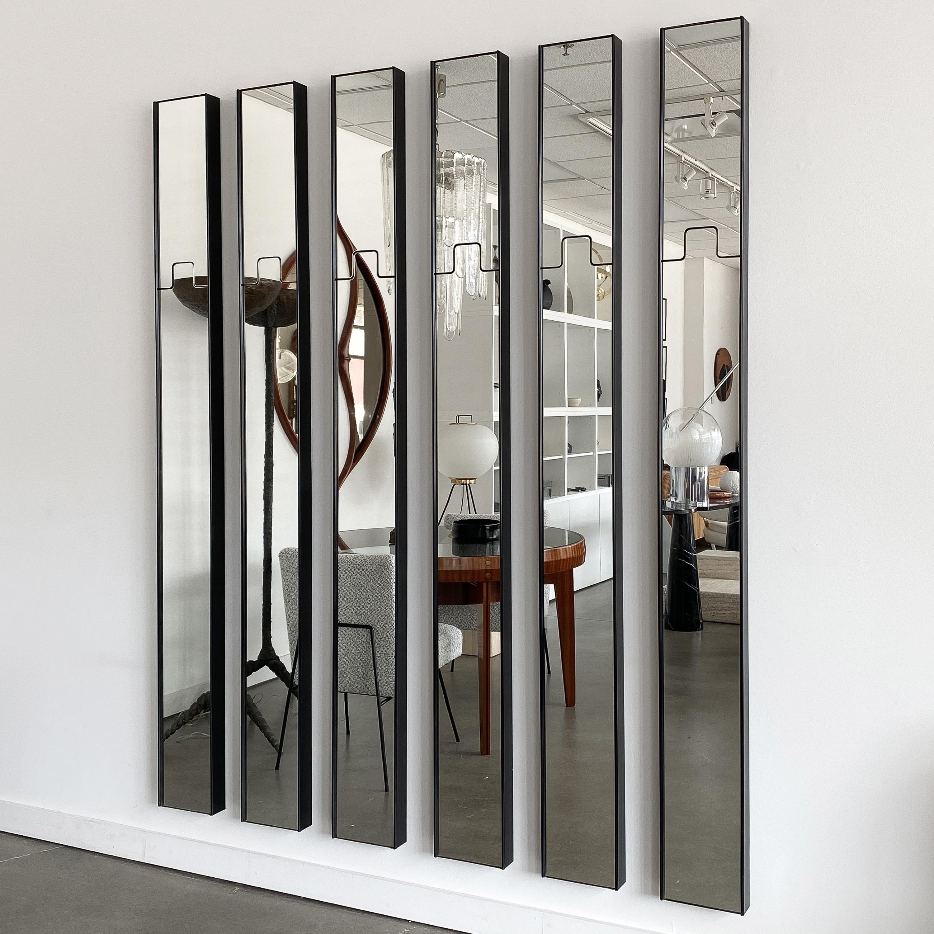 Set of 6 modular Gronda wall mirrors with integrated coat rack by Luciano Bertoncini for Elco, circa 1970s. Each clear glass mirror is framed in black plastic and measures 79